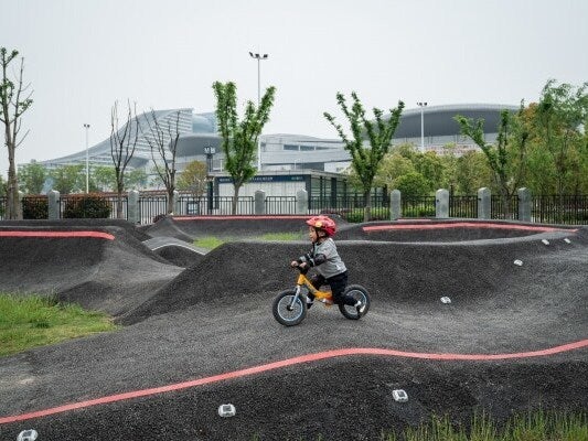 Two-year-old Xiao Kaixi riding a balance bike in Wuhan (The Washington Post)