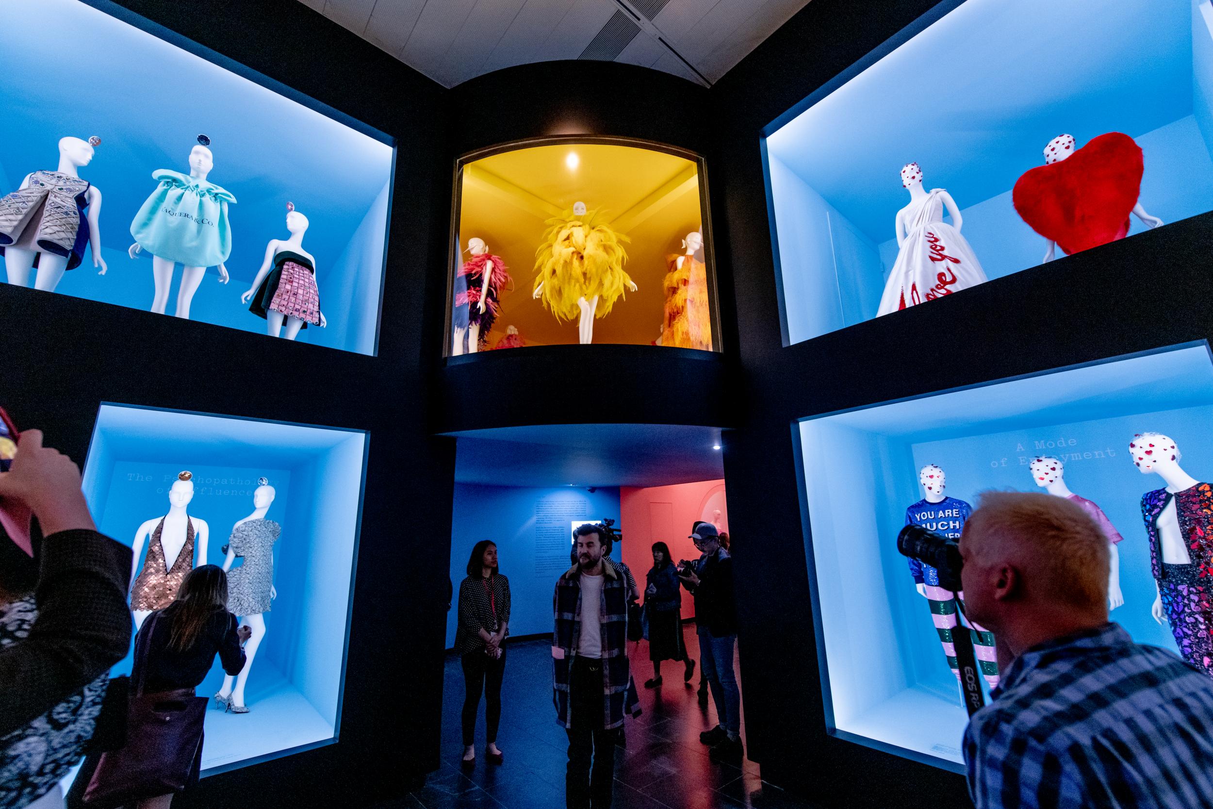 While the first part of the exhibit takes place in purposefully claustrophobic corridors, the second half opens onto a vast room with outfits displayed from floor to ceiling.