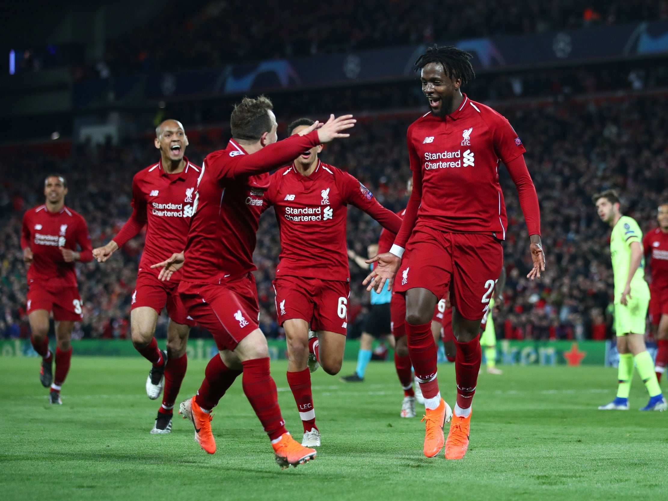 Origi is mobbed by his team-mates (Getty Images)