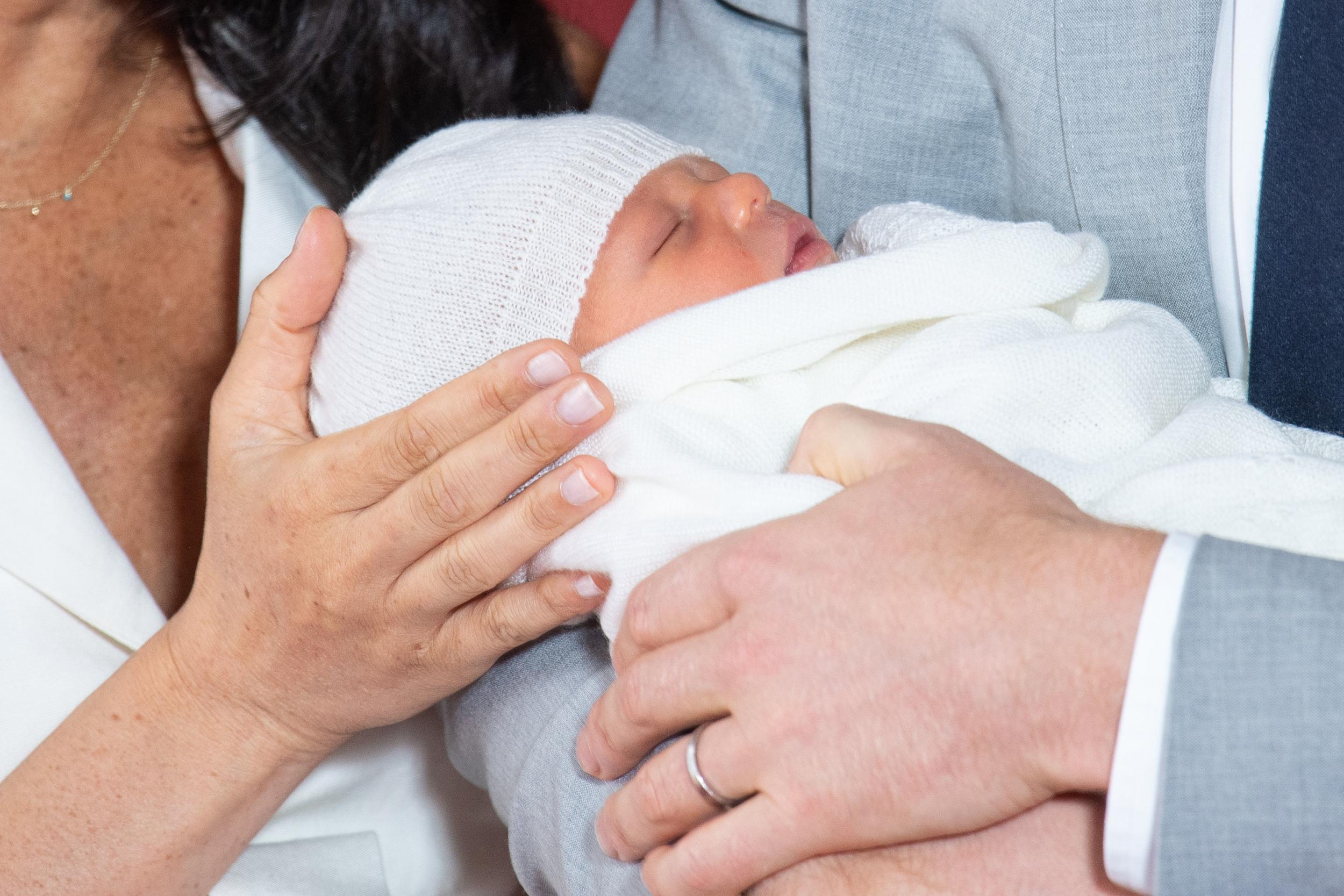 The Duke and Duchess of Sussex with their baby son, who was born on Monday morning, during a photocall in St George's Hall at Windsor Castle in Berkshire. (PA_Images)