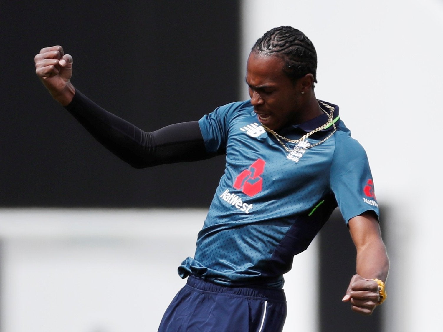 Archer celebrates taking the opening wicket