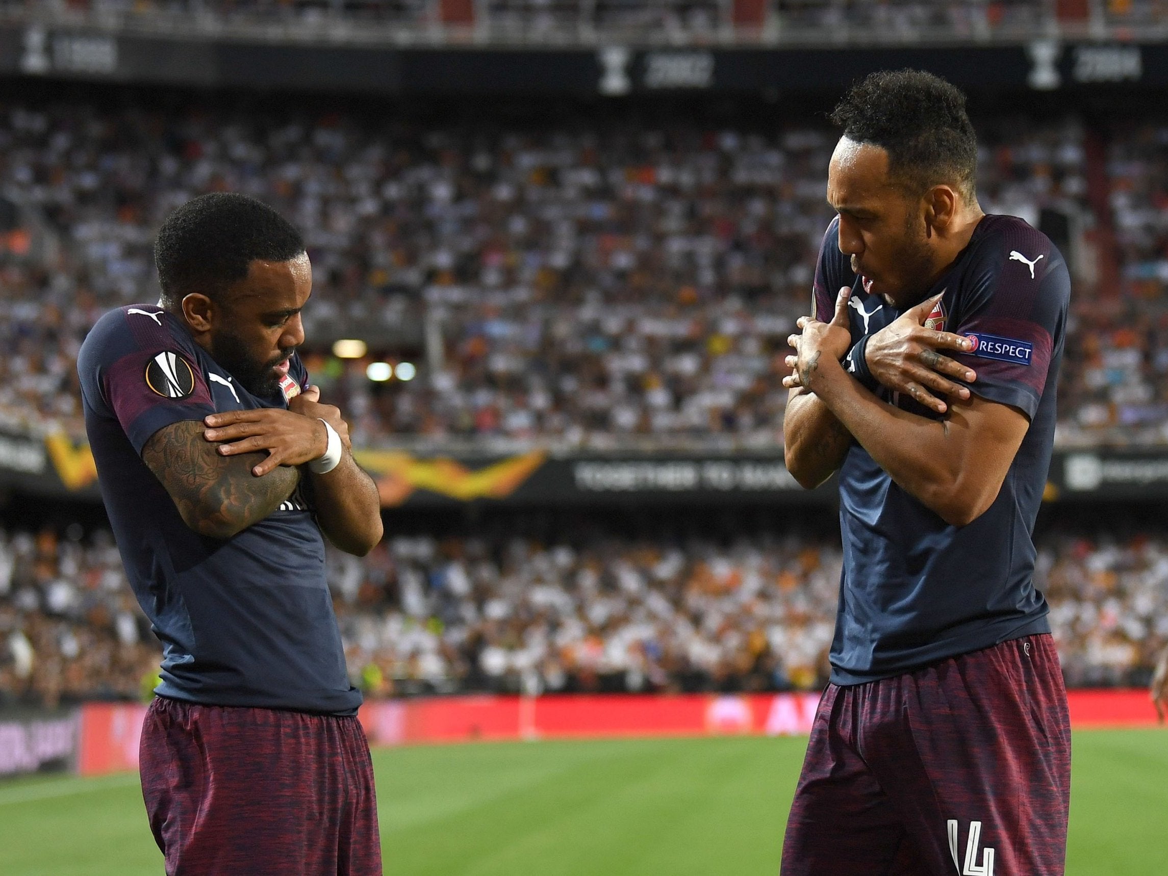 Aubameyang celebrates scoring with Lacazette in Arsenal's victory over Valencia