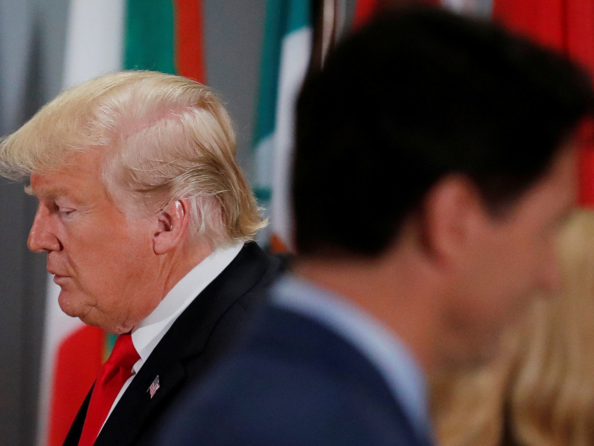 Donald Trump passes Justin Trudeau during a working lunch for world leaders at the United Nations General Assembly