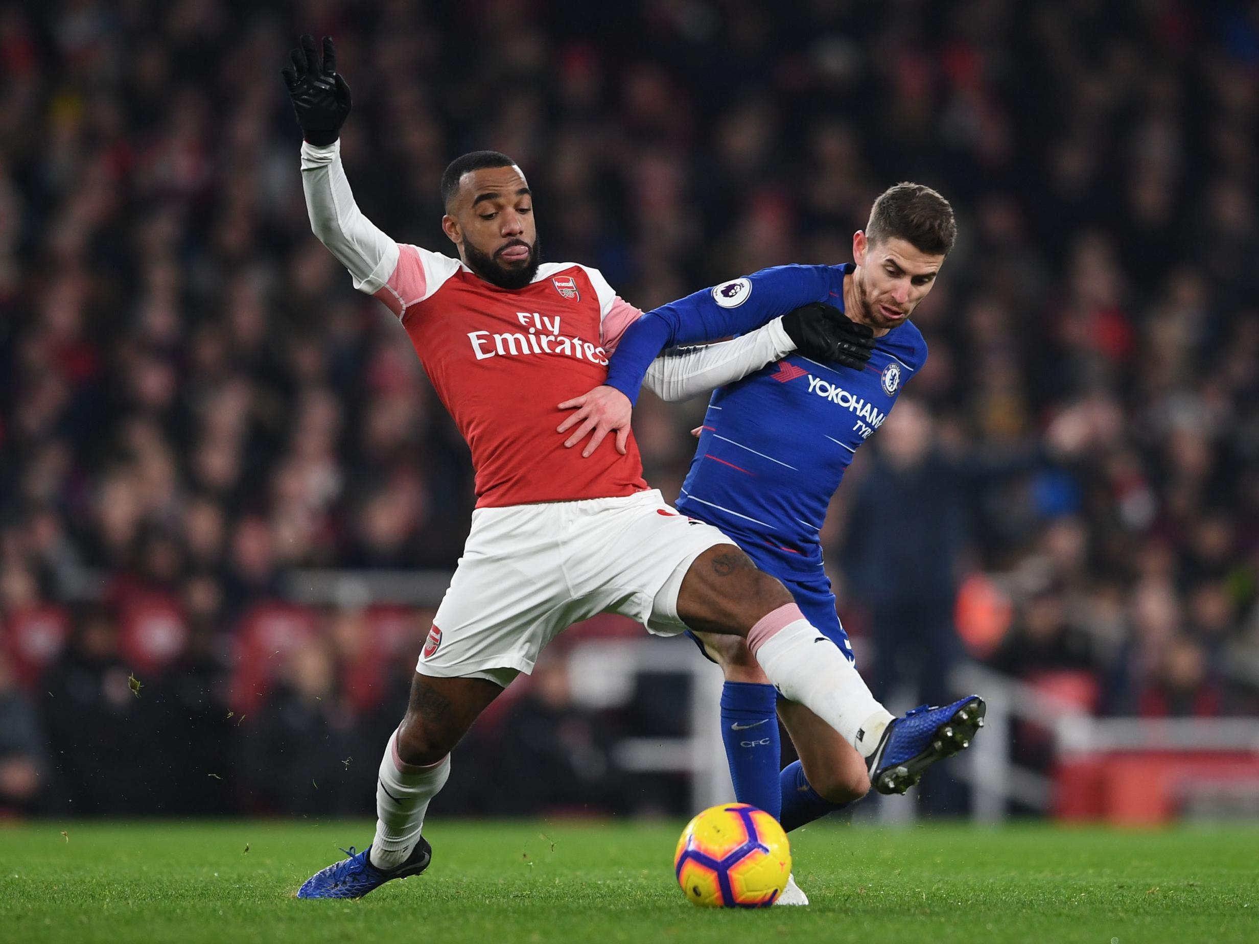 Lacazette and Jorginho battle for the ball