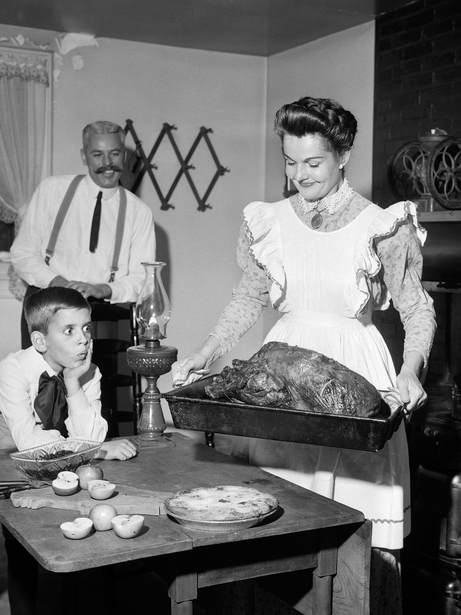 A photograph taken in 1950 shows the types of aprons worn by maids