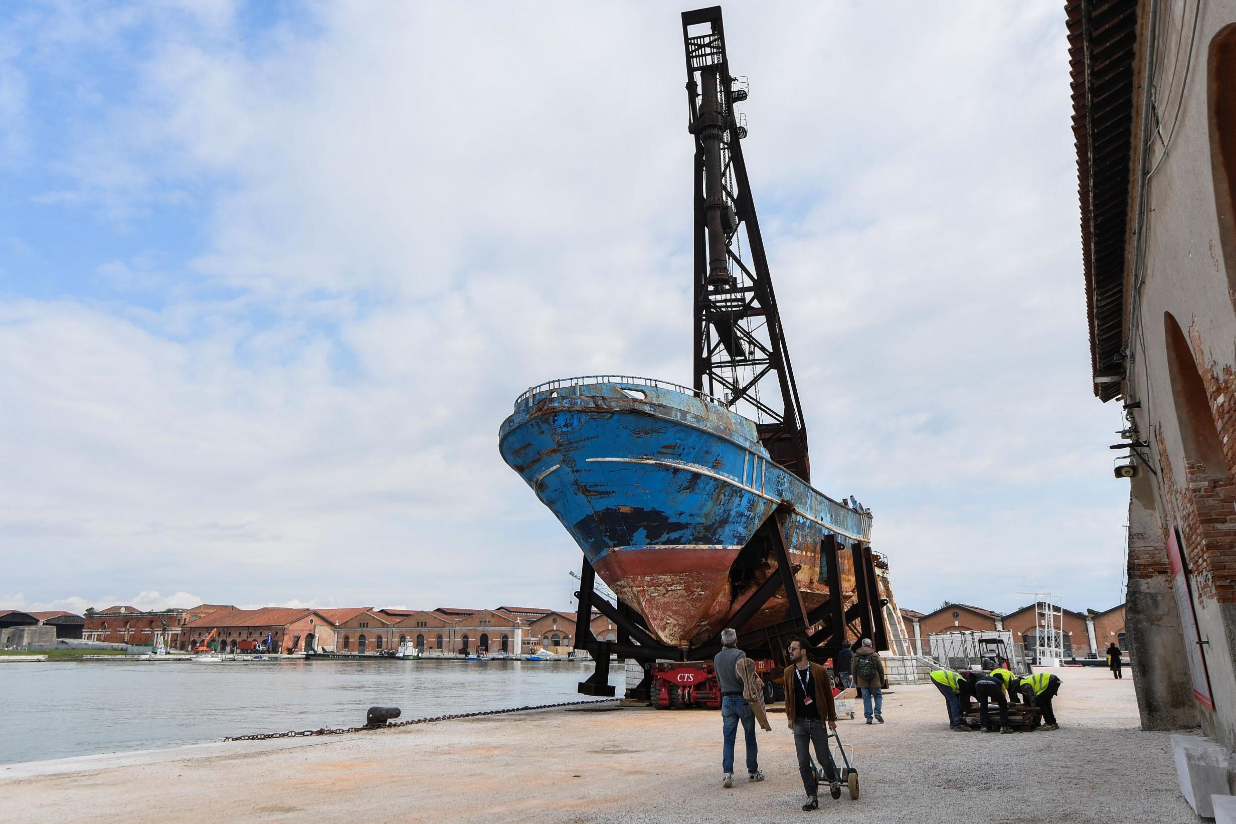 ‘Barca Nostra’ by Christoph Buchel, is drydocked near the Biennale site (AFP/Getty)