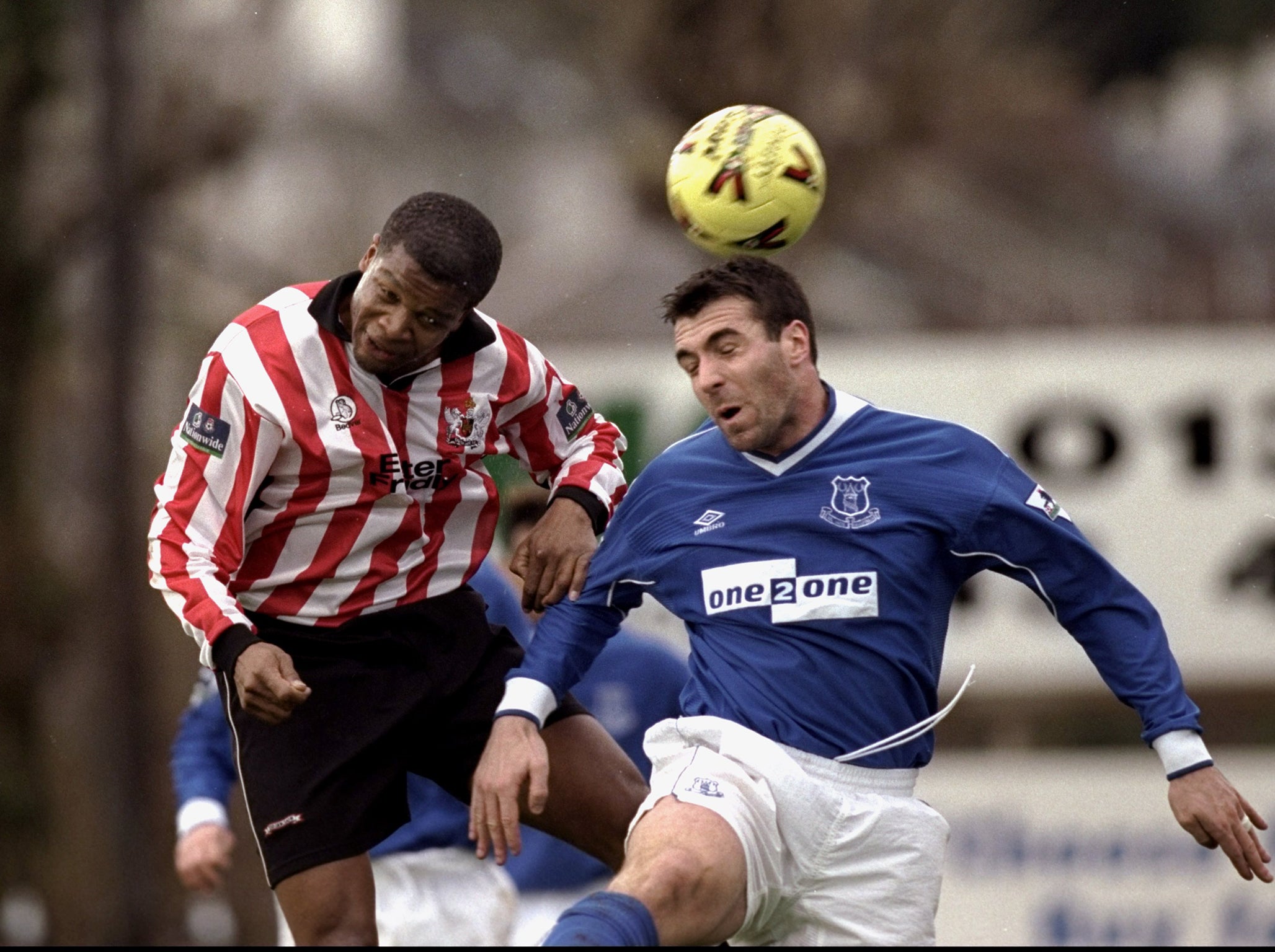 Jon Gittens (L) playing for Exeter against Everton in 1999