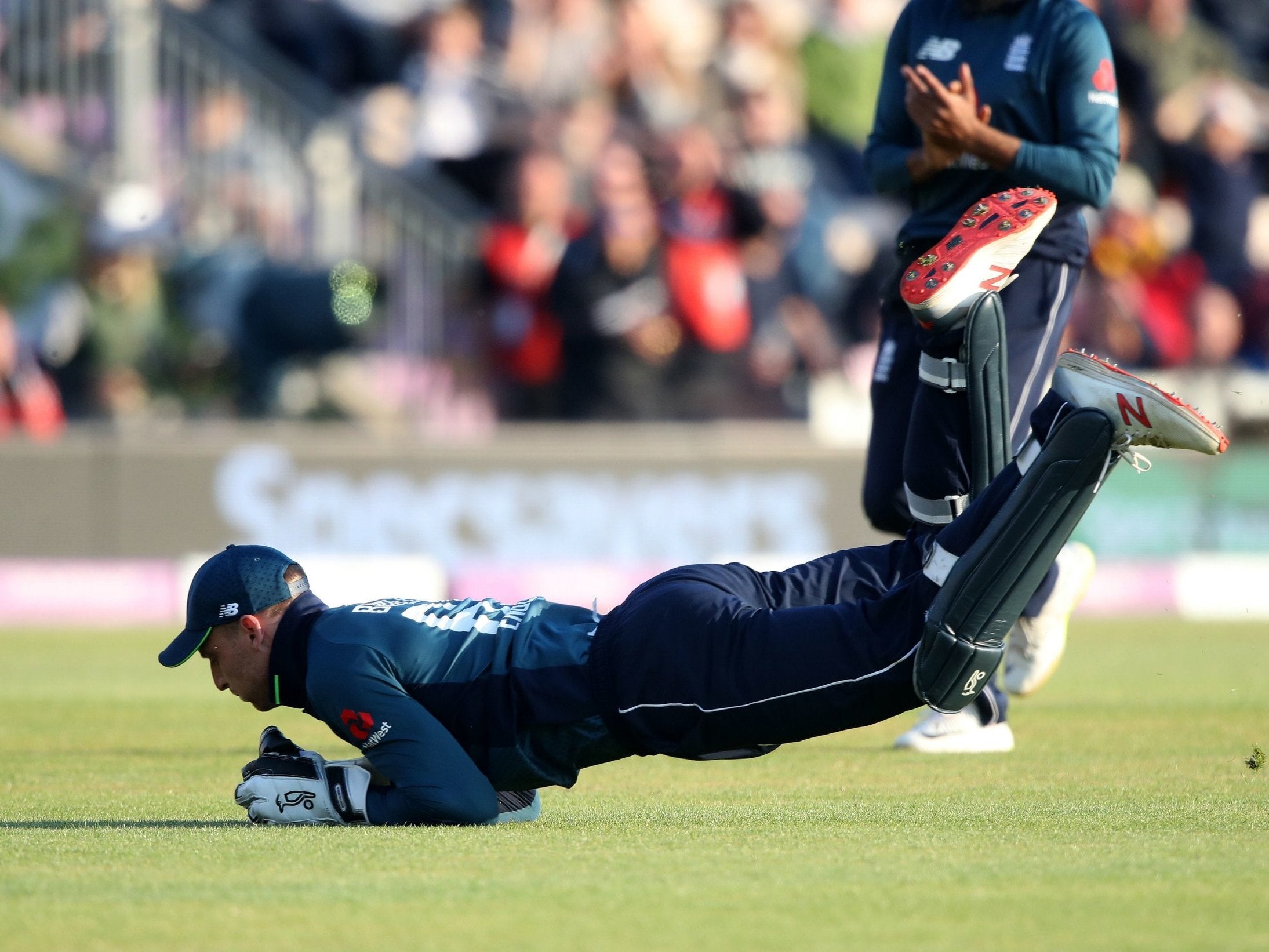 Jos Buttler takes the catch of Pakistan's Imad Wasim