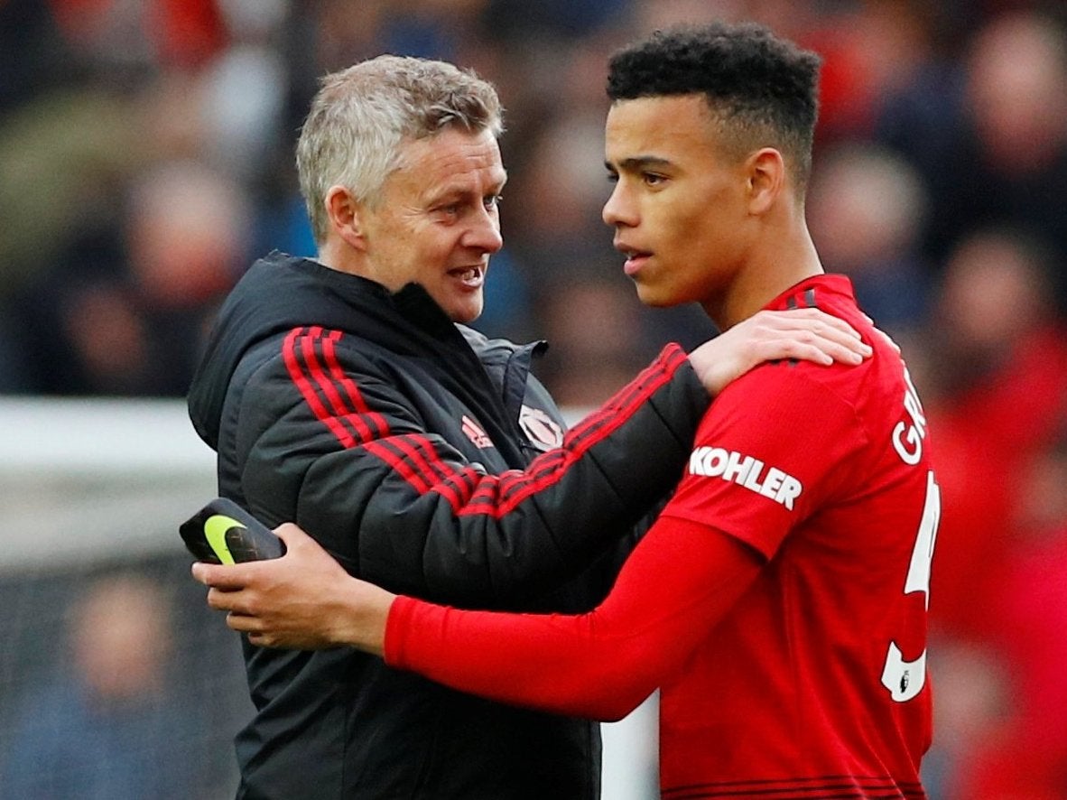 Ole Gunnar Solskjaer and Mason Greenwood celebrate after the match