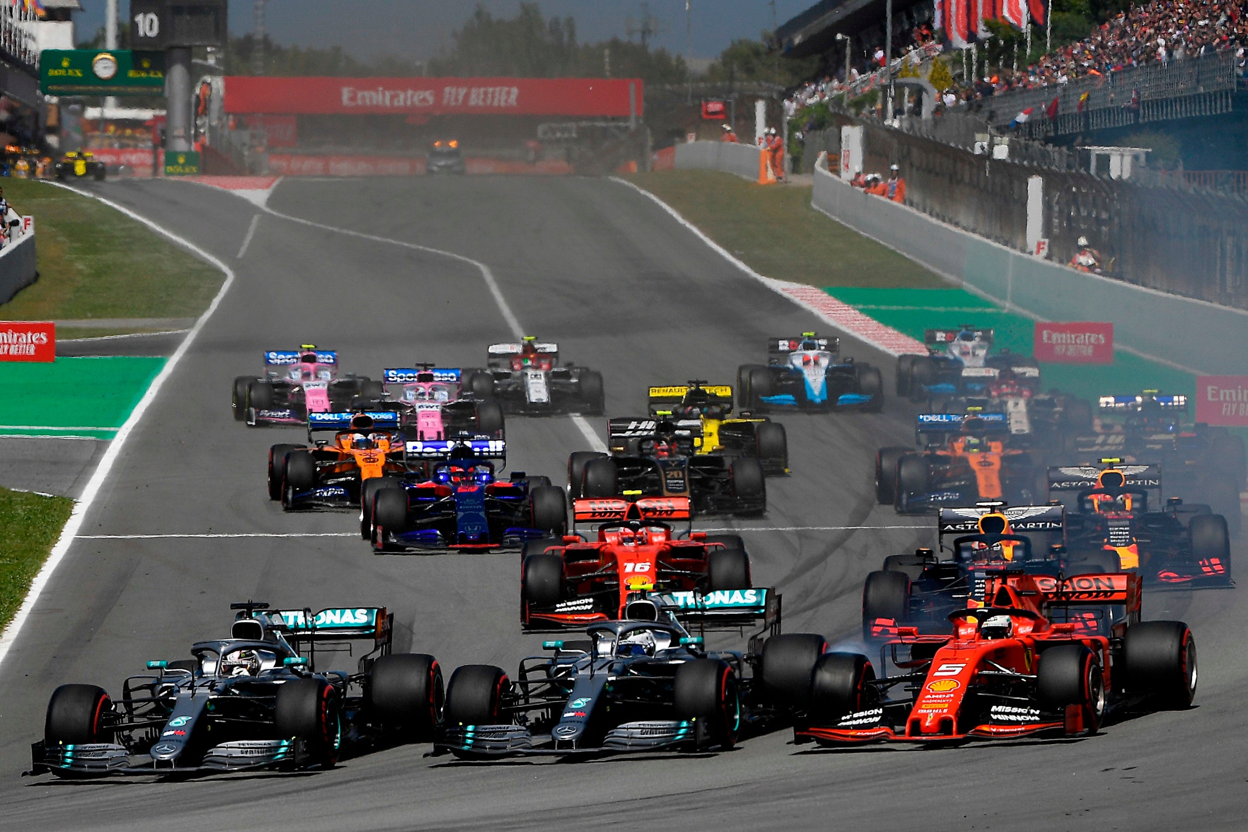 Hamilton passed Bottas and Vettel to lead into Turn One (AFP/Getty)