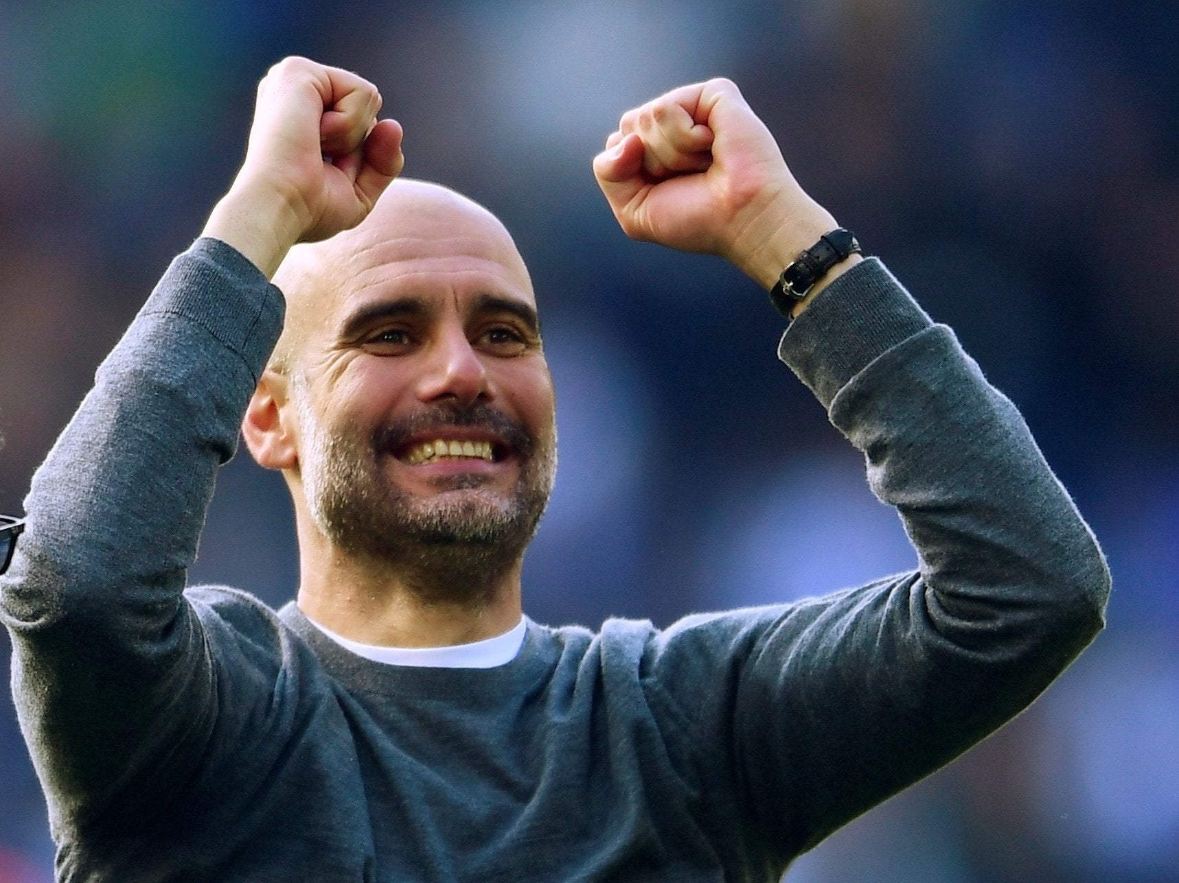 Manchester City manager Pep Guardiola celebrates winning the league