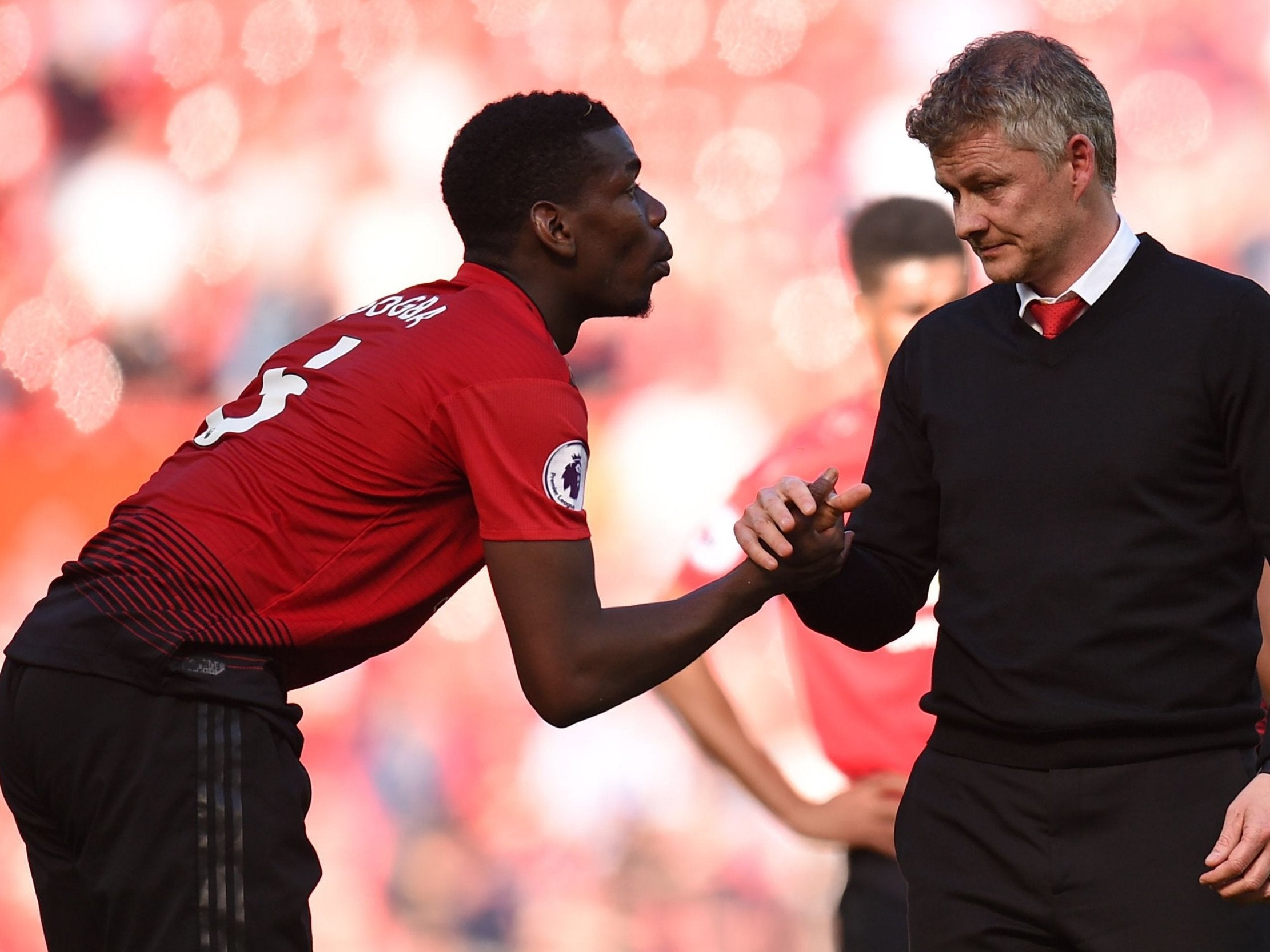 Pogba shakes hands with United manager Solskjaer after defeat by Cardiff