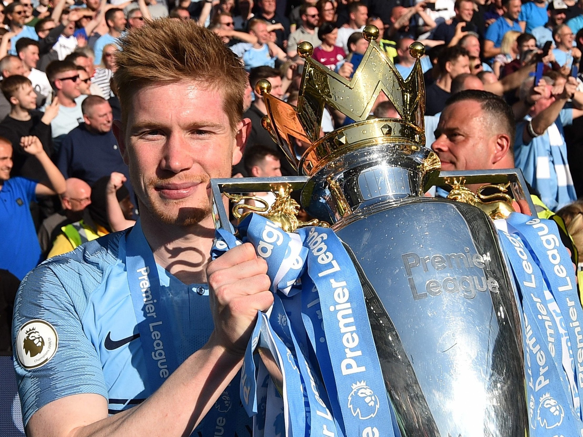 Kevin De Bruyne celebrates with the Premier League trophy