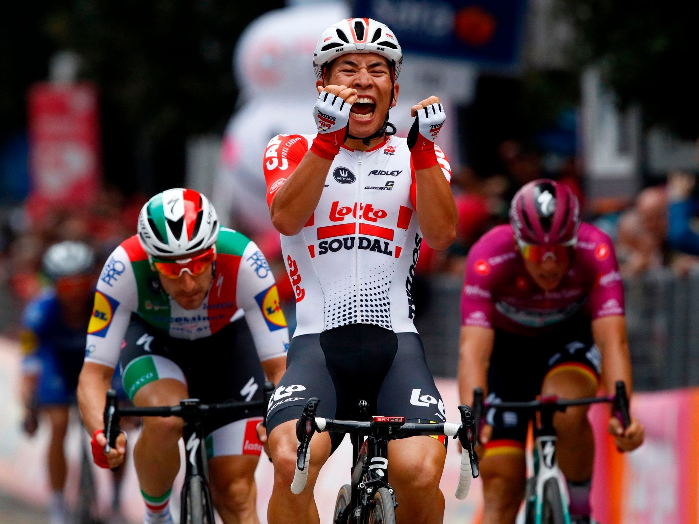 Caleb Ewan celebrates clinching victory in Pesaro