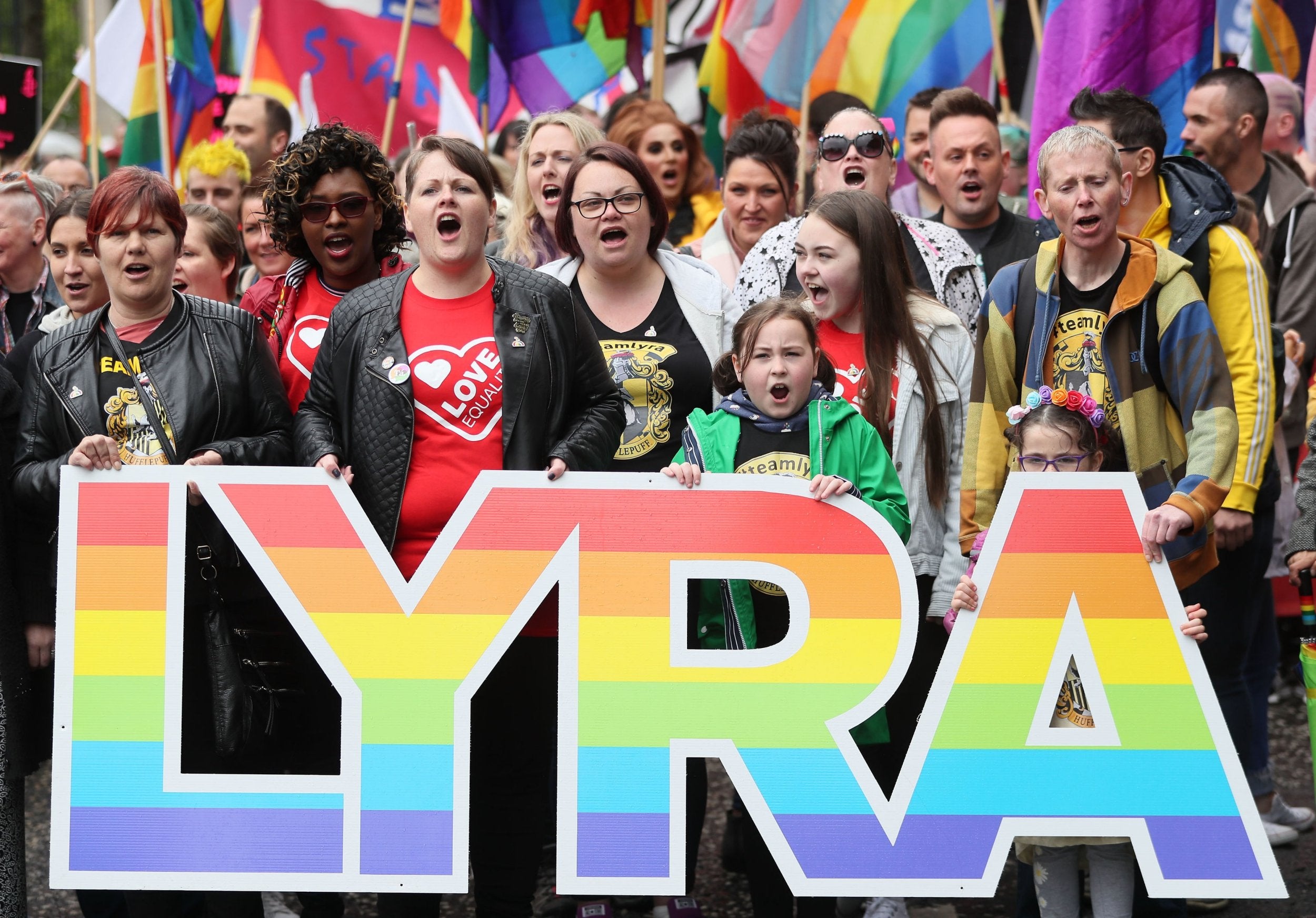 Sara Canning (front centre left), partner of murdered journalist Lyra McKee, marching with protesters through Belfast city centre