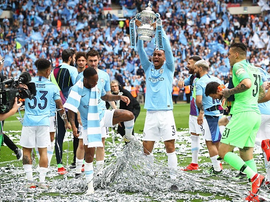 City celebrate after winning the FA Cup