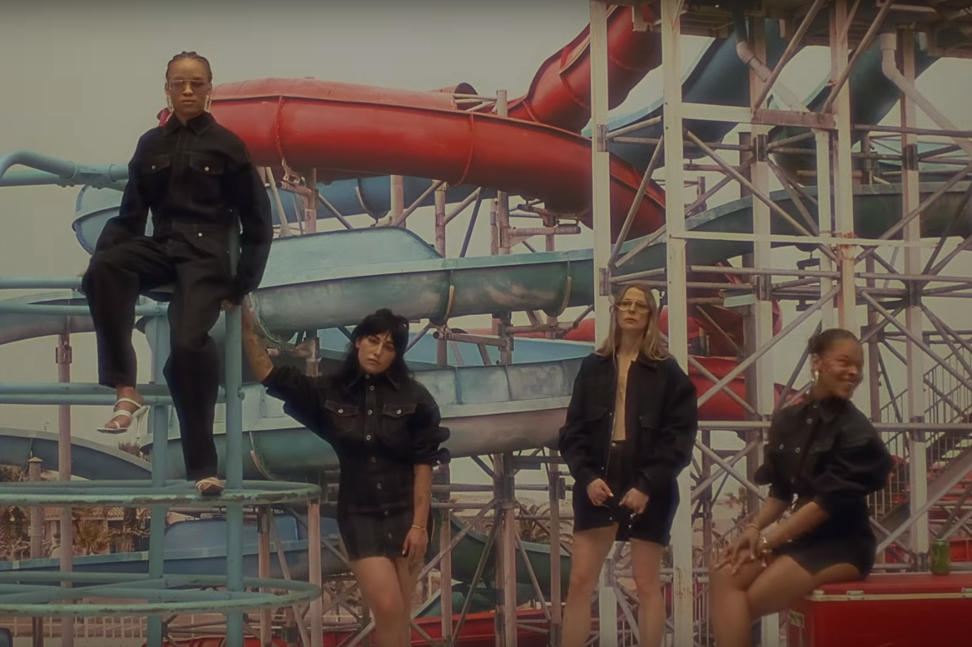 Models pose in what appears to be an abandoned water park (FENTY/YouTube)