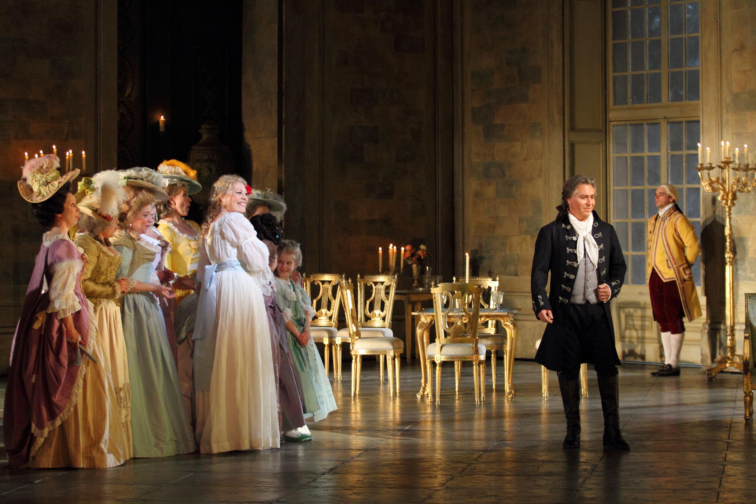 Sondra Radvanovsky (white dress) as Maddalena di Coigny and Roberto Alagna (right) as Andrea Chenier