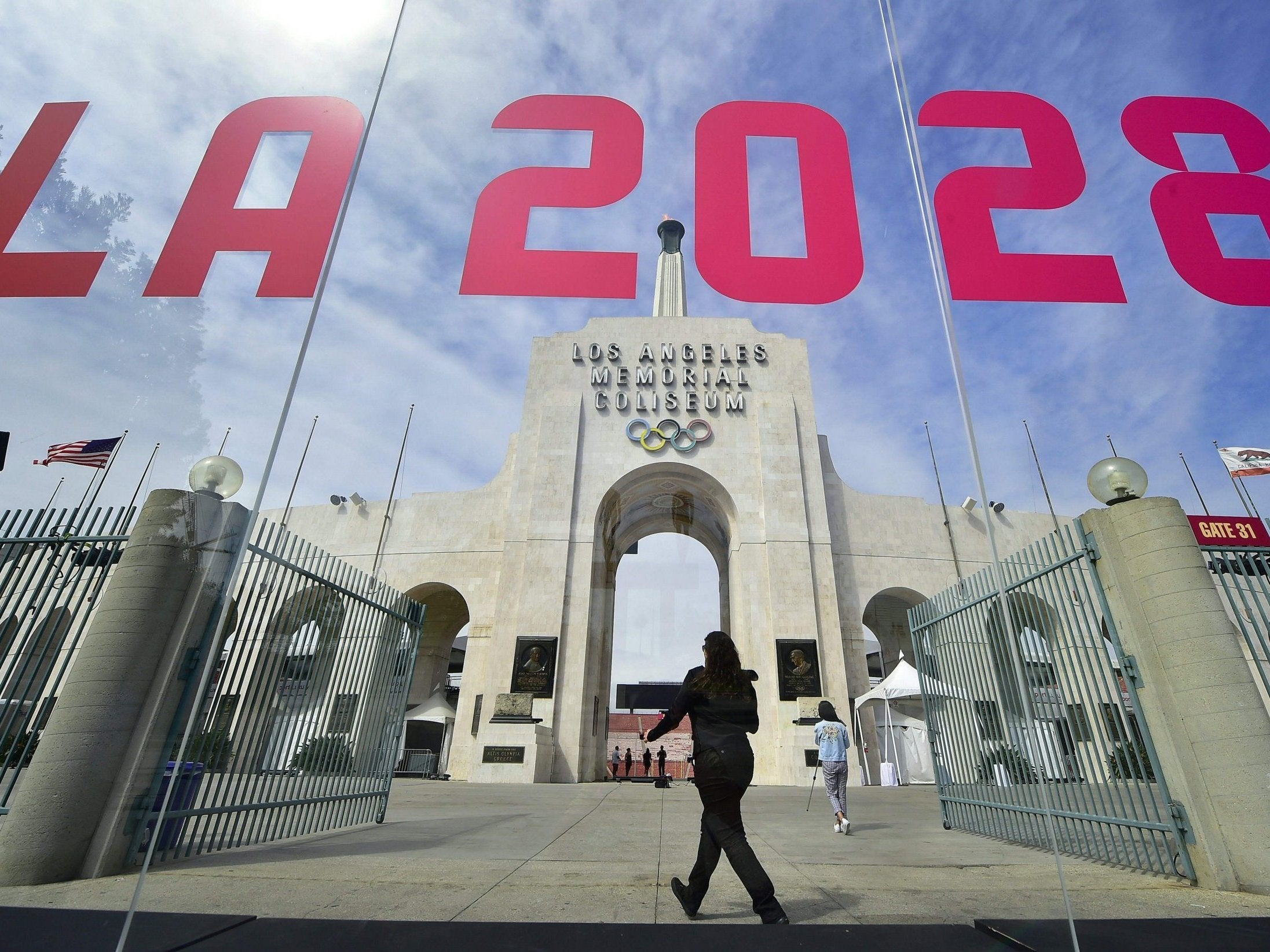 The torch is lit at the Los Angeles Coliseum after being named 2028 host