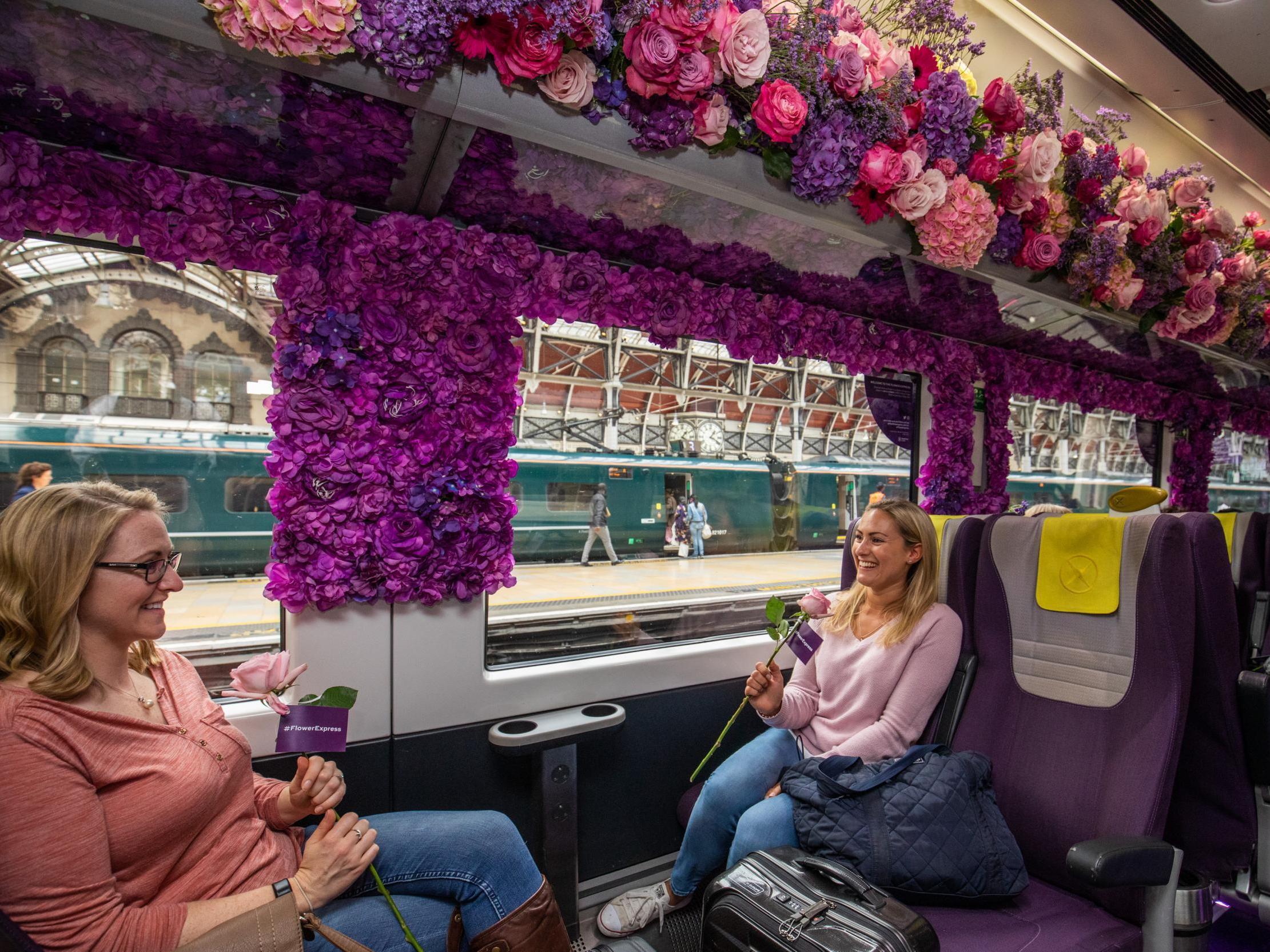 Passengers admire the Heathrow Flower Express