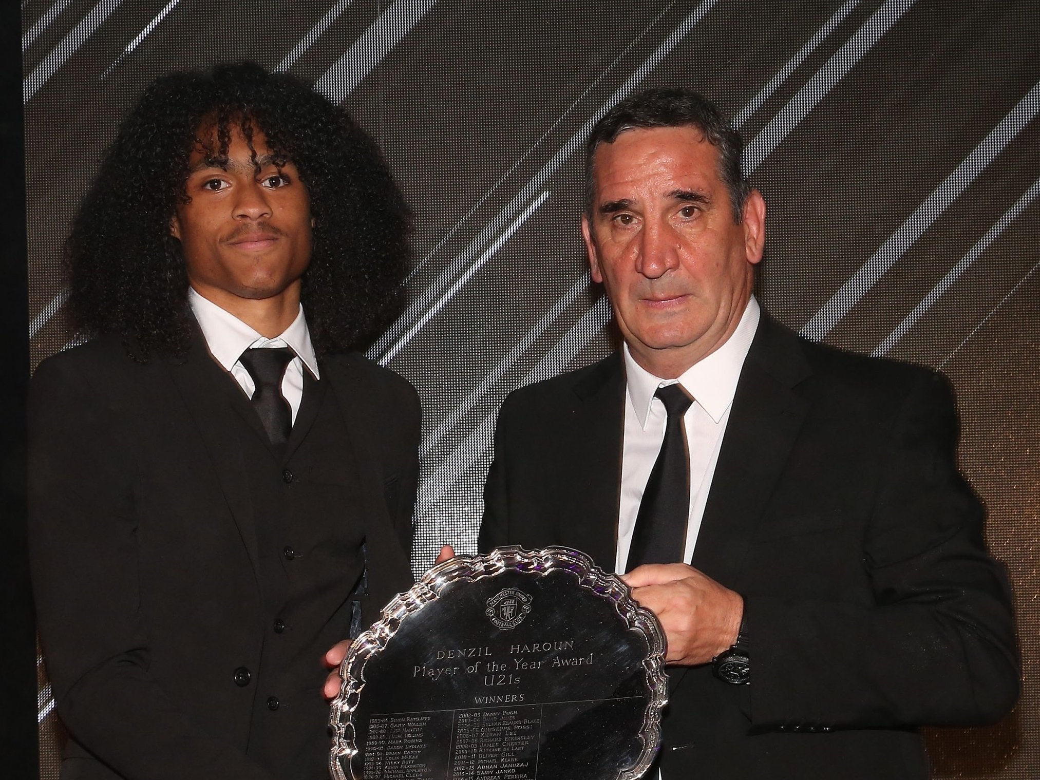 Ricky Spragia pictured presenting Tahith Chong with reserve player of the year award