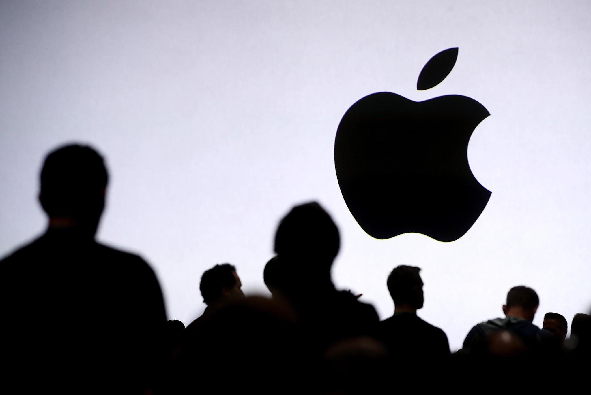 Attendees wait for the start of the 2017 Apple Worldwide Developer Conference (WWDC) at the San Jose Convention Center