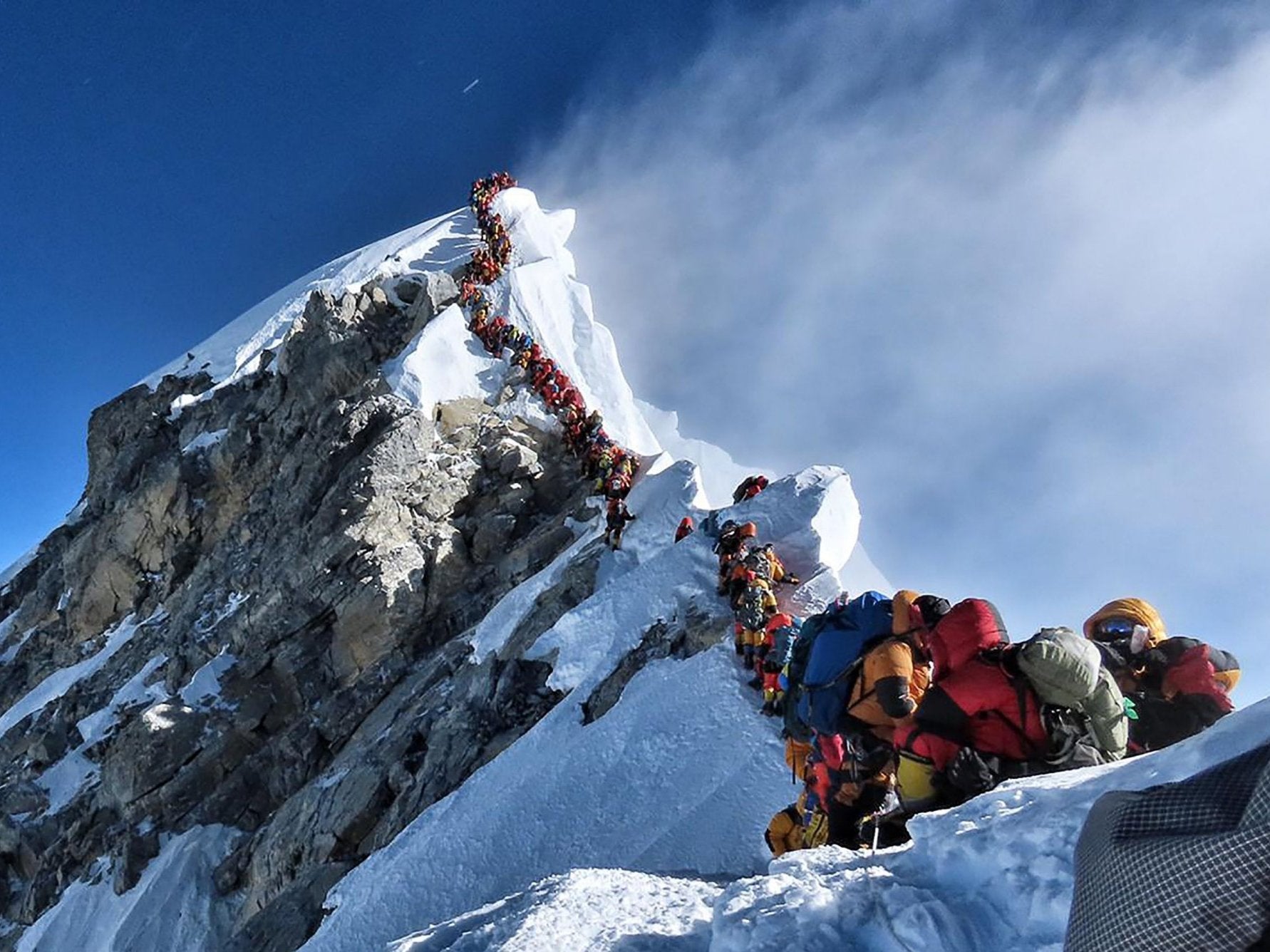 Mount Everest suffers 'traffic jam' after two climbers die near summit