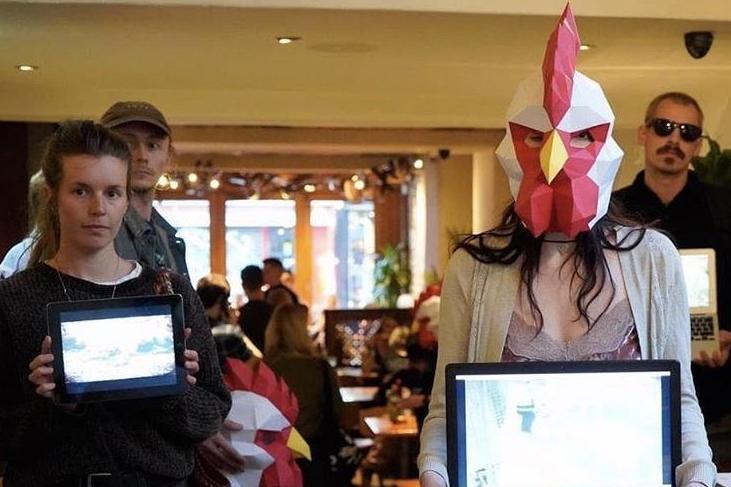 Vegan protestors wore chicken masks to demonstrate in Nando's (Occupy Nando's)