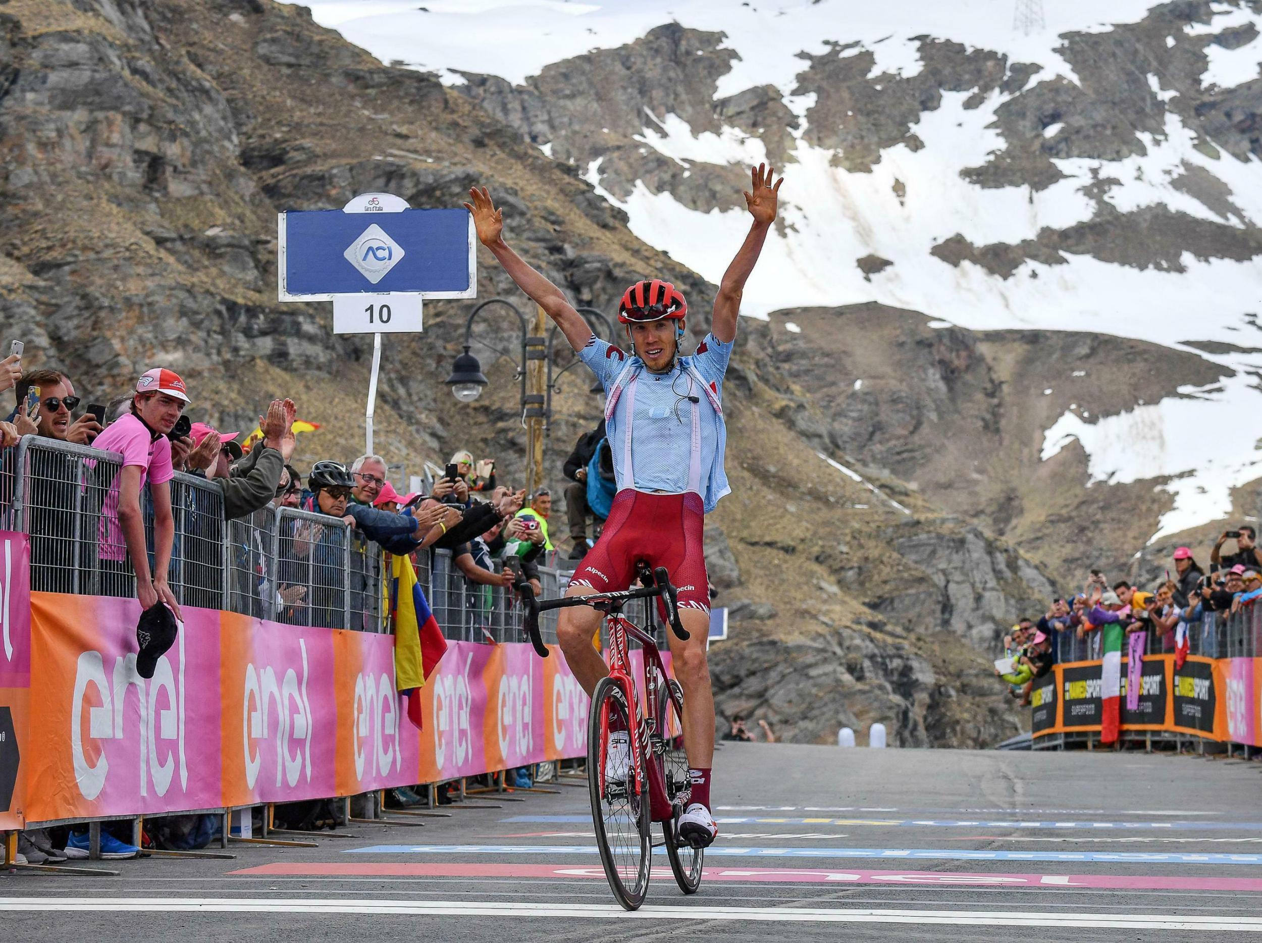 Russia's Ilnur Zakarin celebrates while crossing the finish line