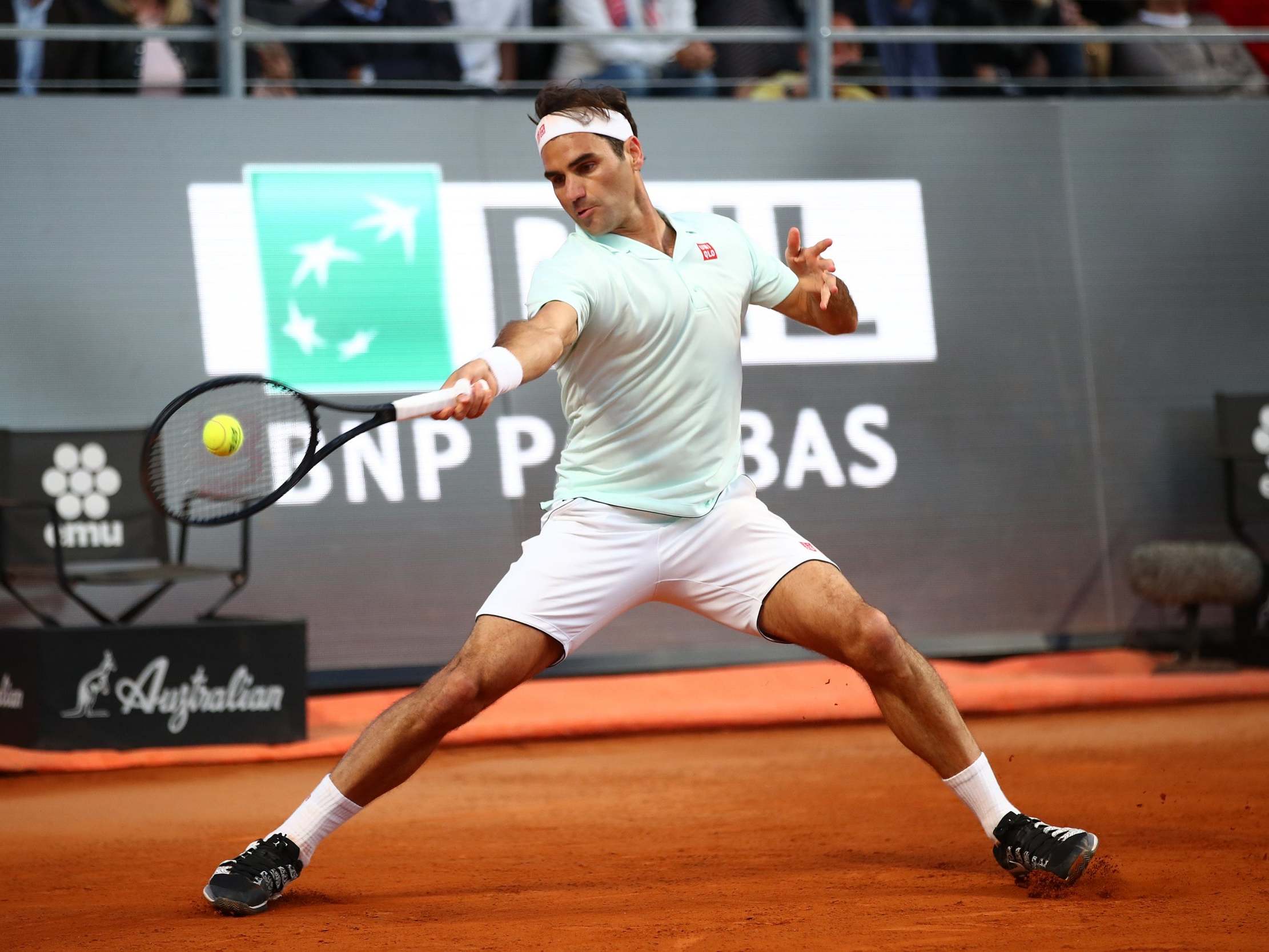 Roger Federer plays a forehand against Borna Coric