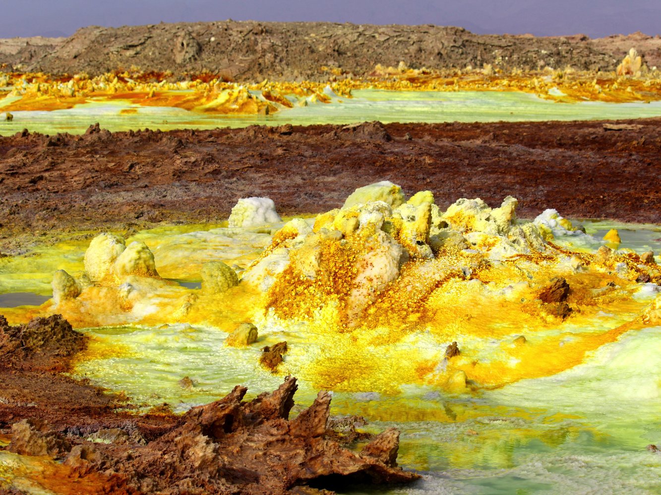 Samples were taken from the central yellow outcrop and water from the blue pool at the bottom (pictured)