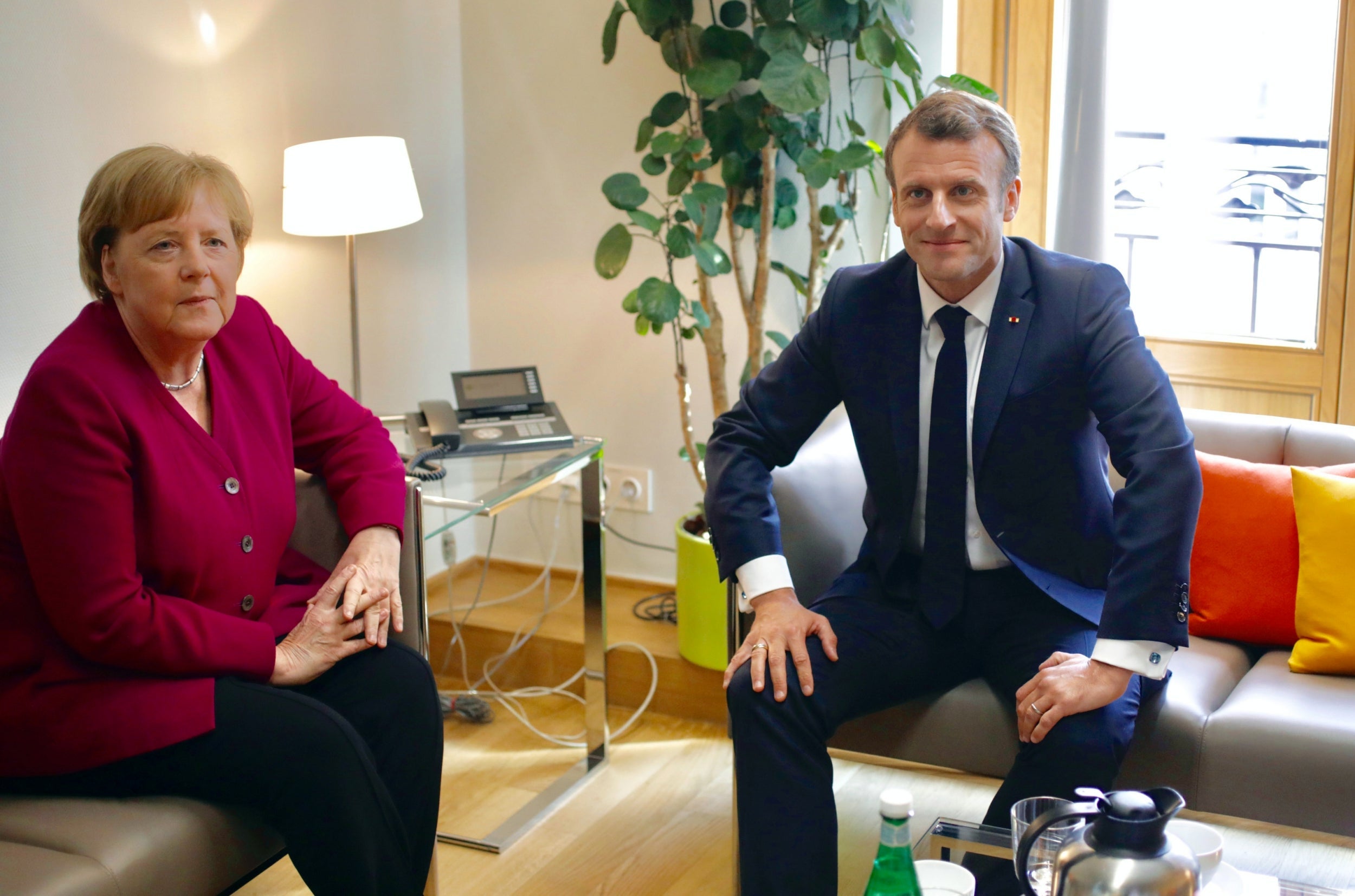 German Chancellor Angela Merkel meets with French President Emmanuel Macron on the sidelines of the European Union leaders summit