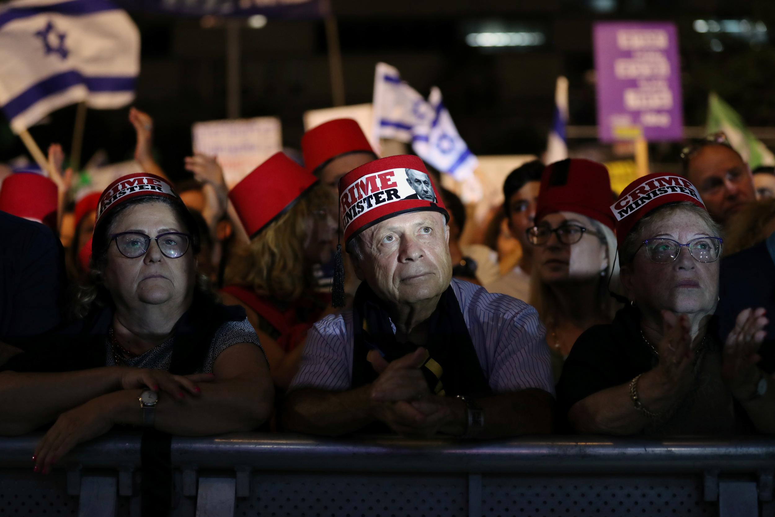 Israelis protest against legislation that could exempt Netanyahu from standing trial, in Tel Aviv