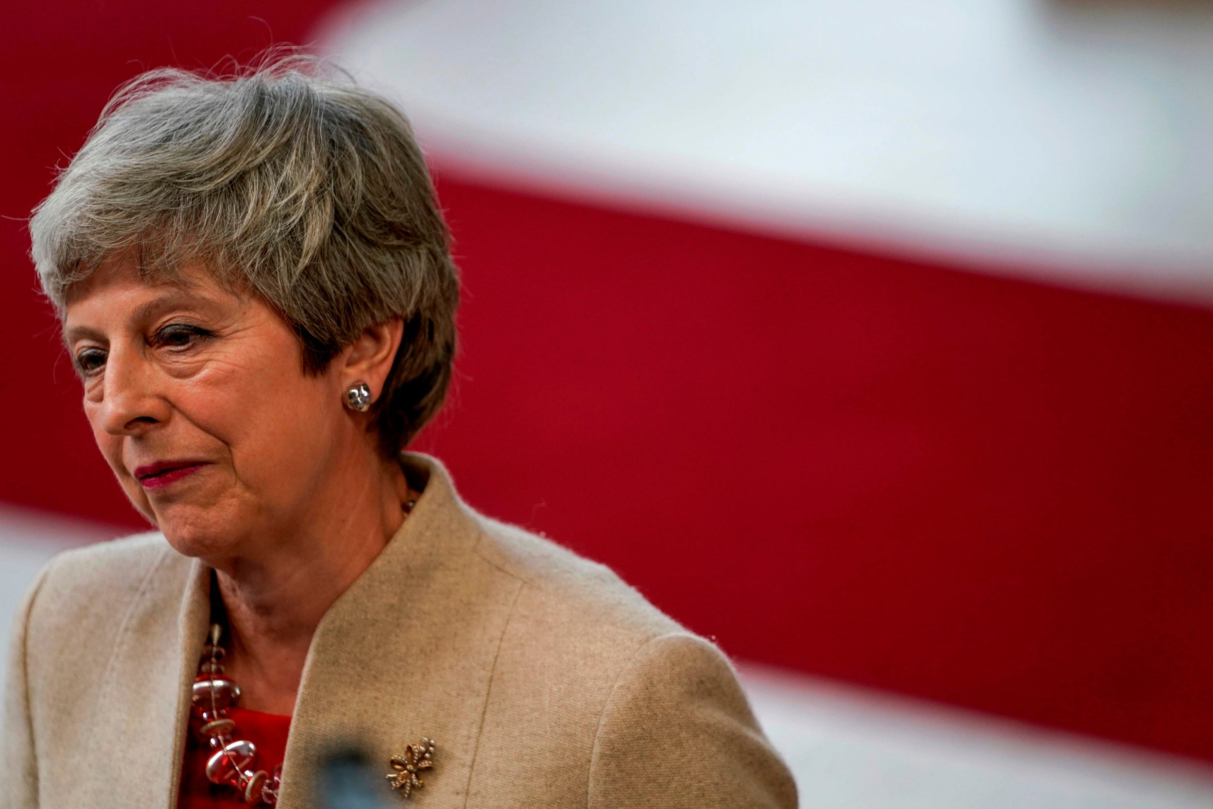 Theresa May speaks to the press as she arrives for a European Union (EU) summit