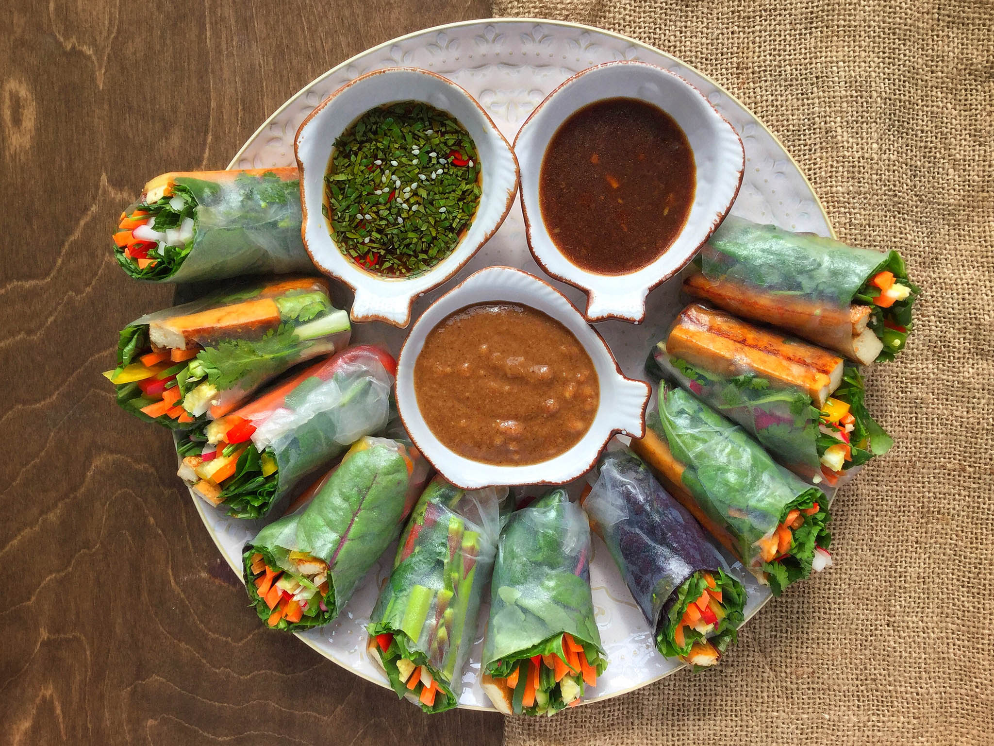 Sauces (clockwise from top left): chilli, lime and coriander; black rice vinegar and sweet chilli; and hoisin and peanut