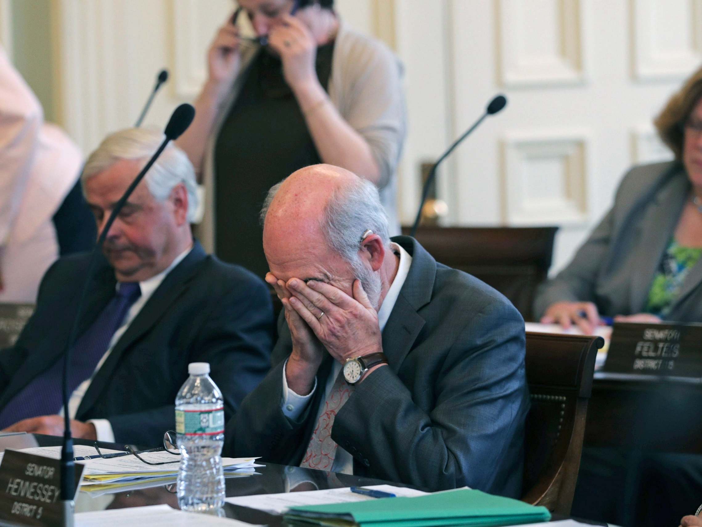 State senator David Watters pauses after the tally was announced in a vote on the death penalty at the State House in Concord, New Hampshire