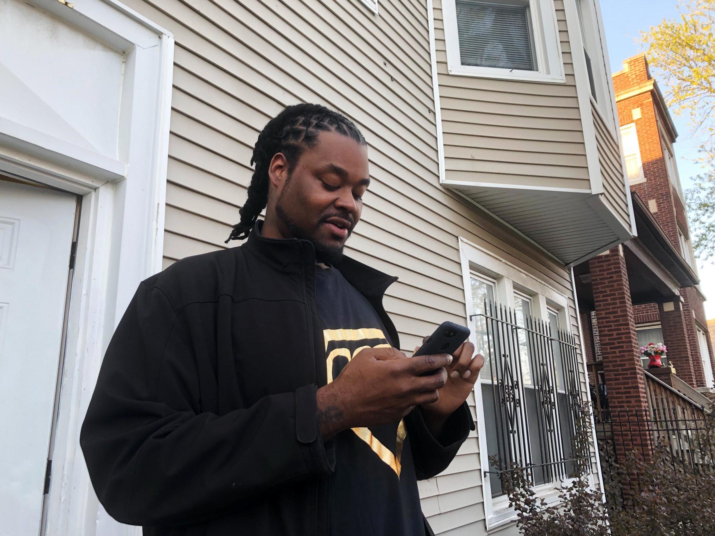 Riccardo Holyfield stands outside his home on the Southside neighborhood in Chicago. His cousin Reo Renee Holyfield's body sat in a dumpster for two weeks in a well-traveled allyway before she was discovered.