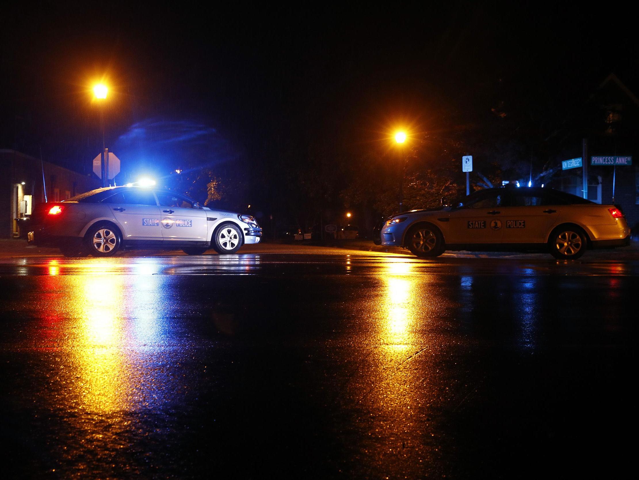 Virginia State Police vehicles block a street near the scene of a shooting at a municipal building in Virginia Beach early on Saturday, 1 June 2019. A longtime city employee opened fire at a municipal building in Virginia Beach on Friday, killing several people.