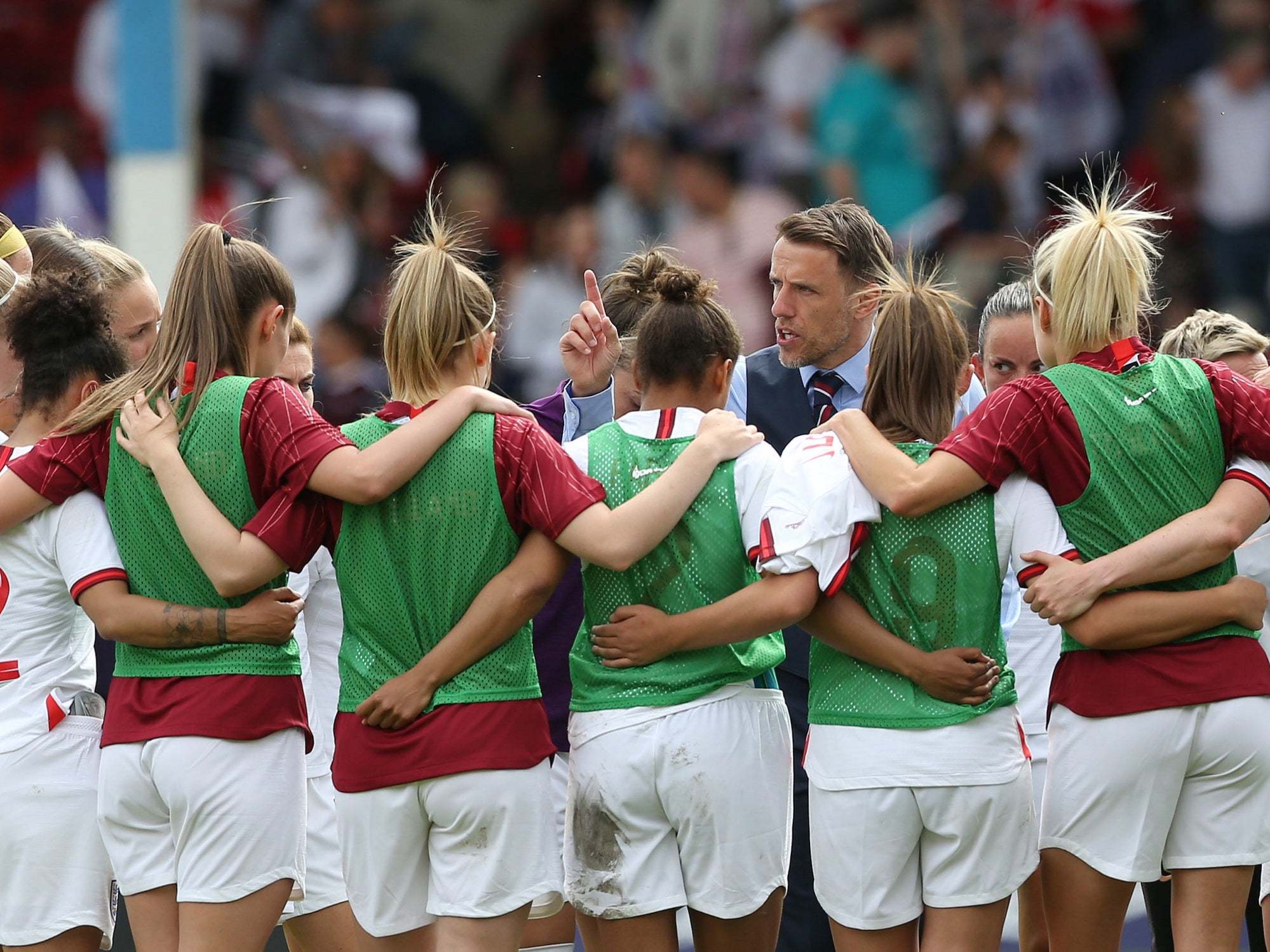 Phil Neville talks to the England players