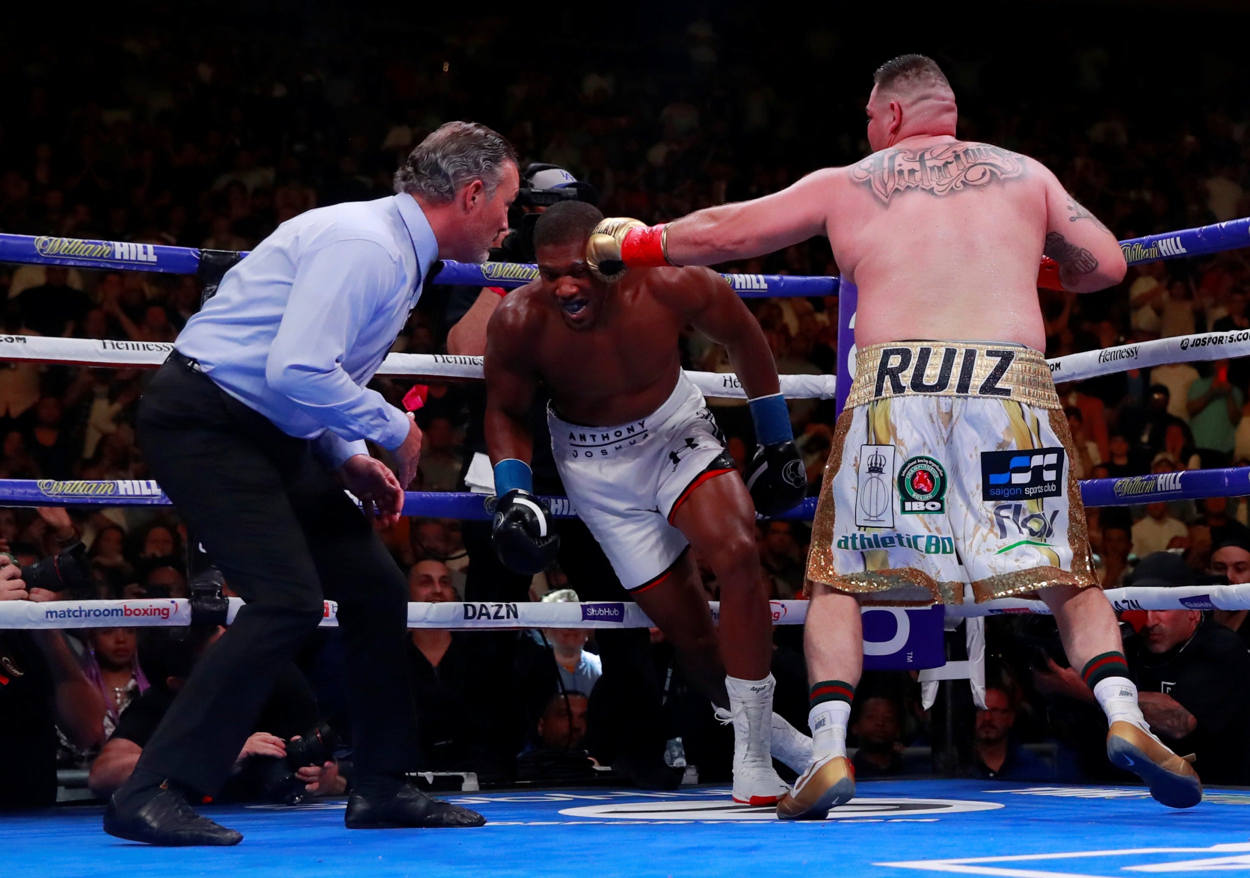 But Ruiz responded by knocking Joshua down twice in the third (Reuters)