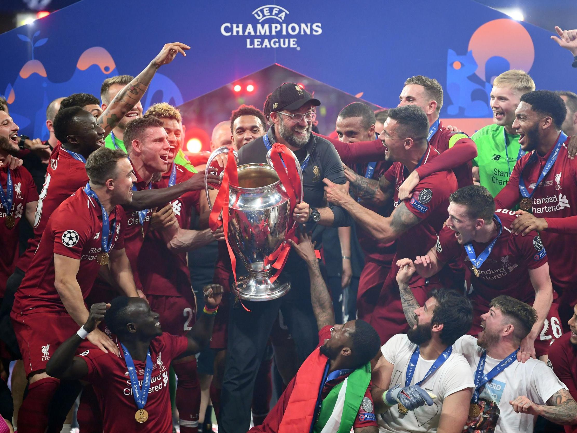 Liverpool celebrate with the Champions League trophy