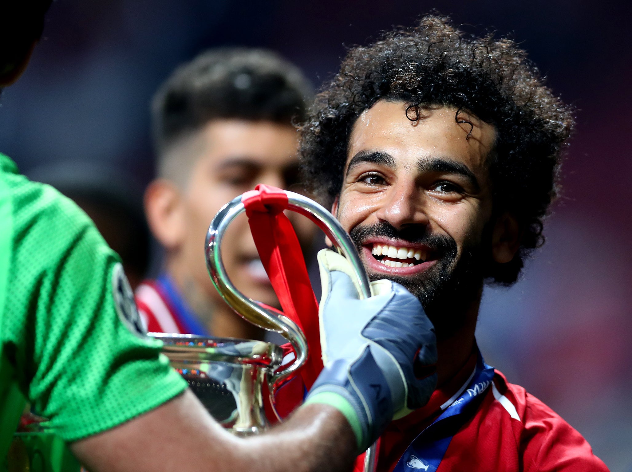 Mohamed Salah celebrates with the Champions League Trophy