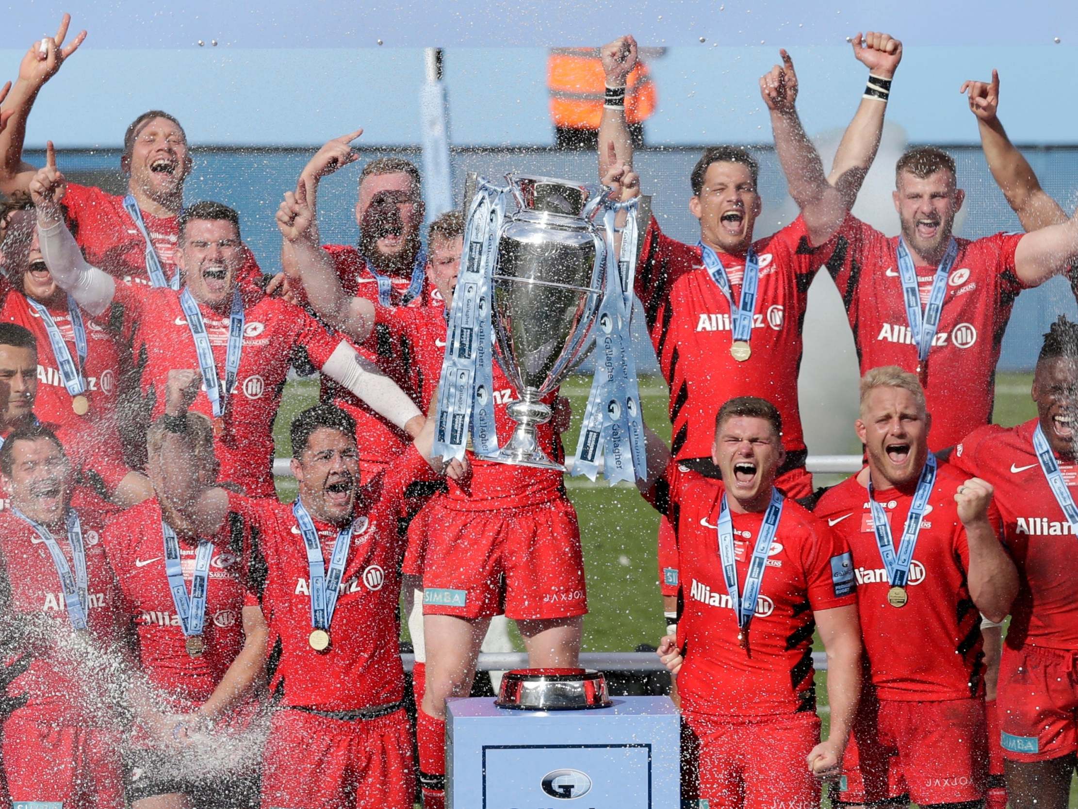 Owen Farrell lifts the Premiership trophy with Brad Barritt after Saracens defeated Exeter Chiefs