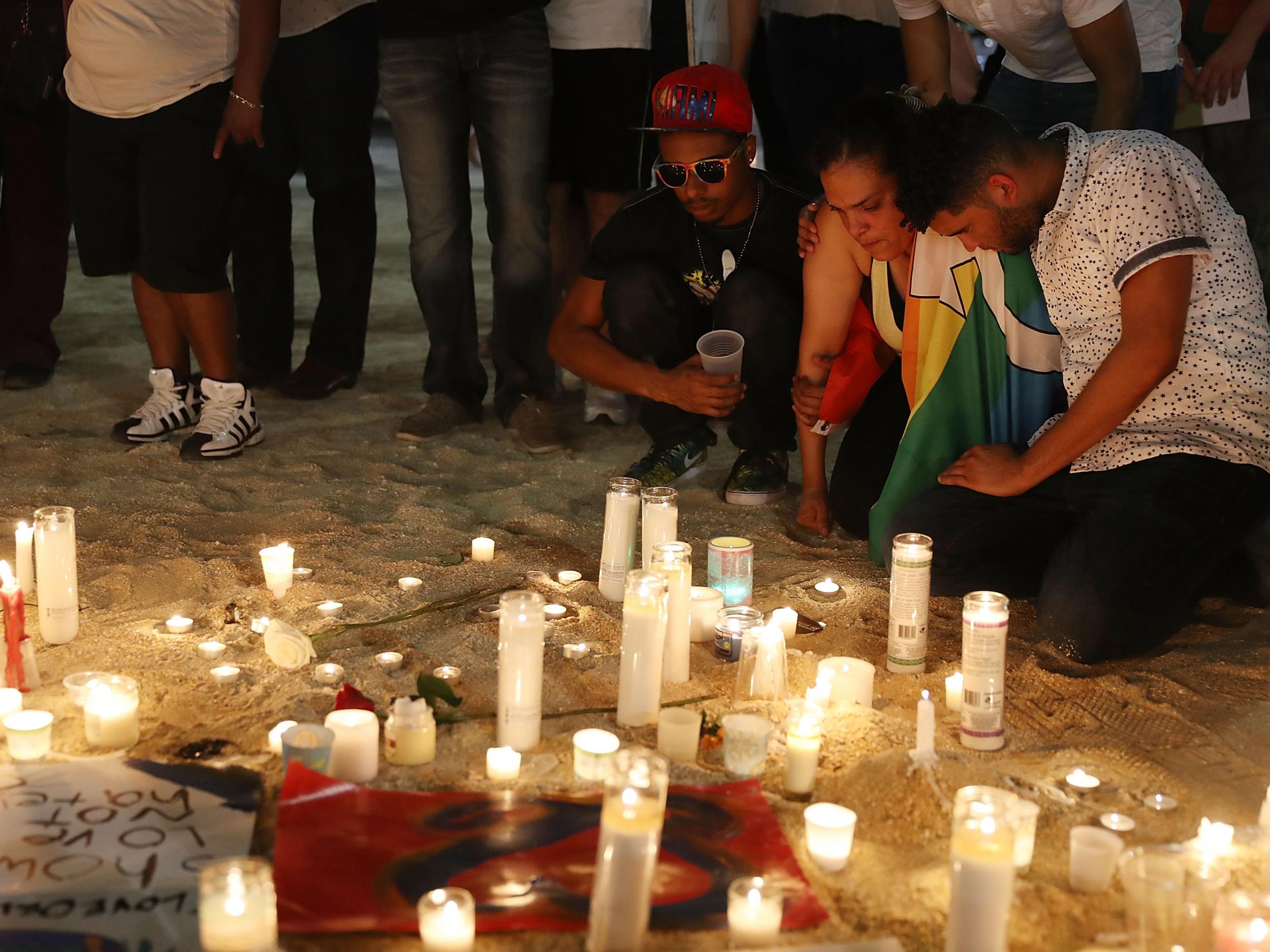 Mourners in Florida pay their respects at a memorial for the Pulse nightclub shooting, in which Omar Mateen killed 49 people