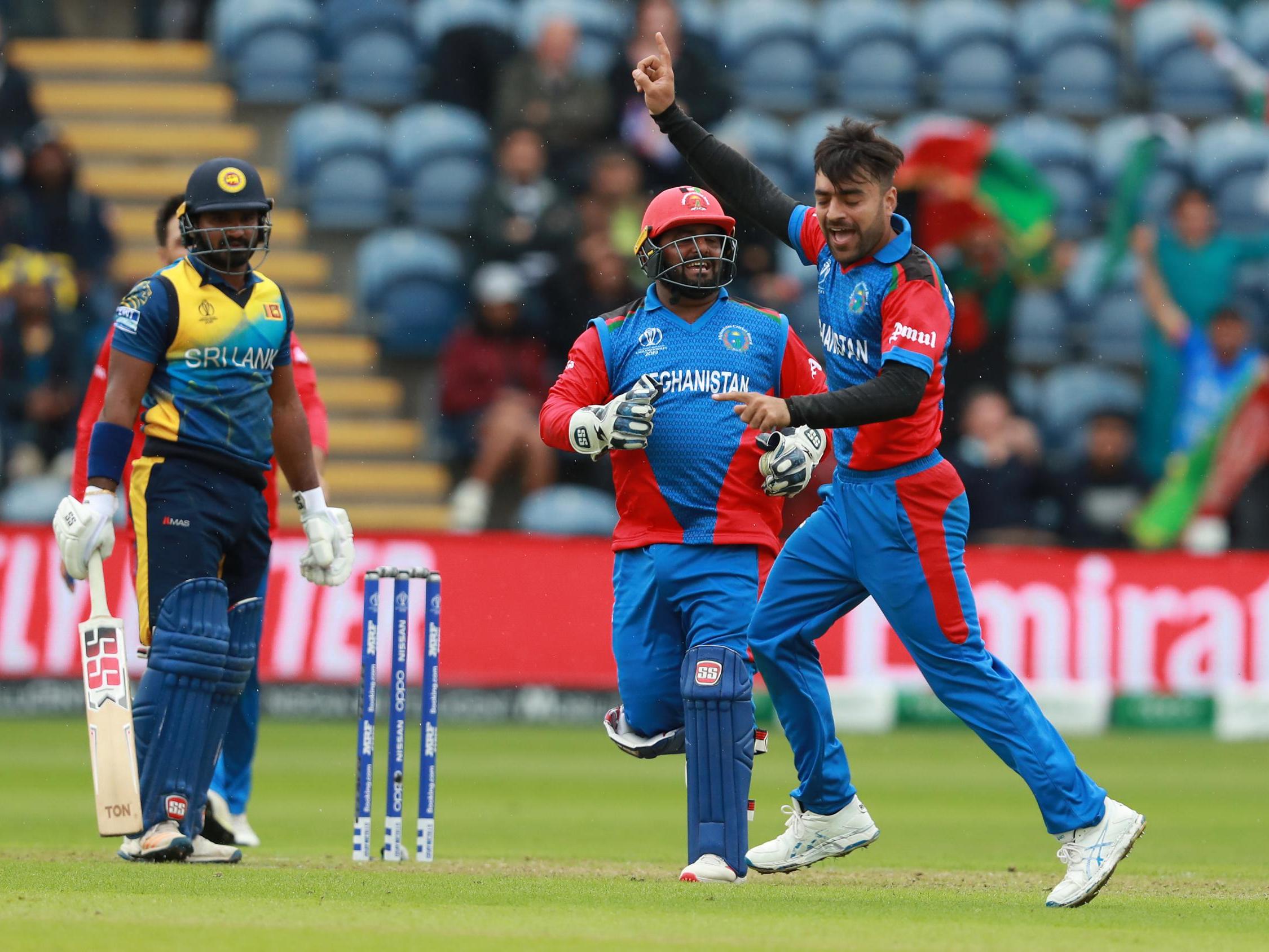 Rashid Khan of Afghanistan celebrates after taking the wicket of Kusal Janith Perera