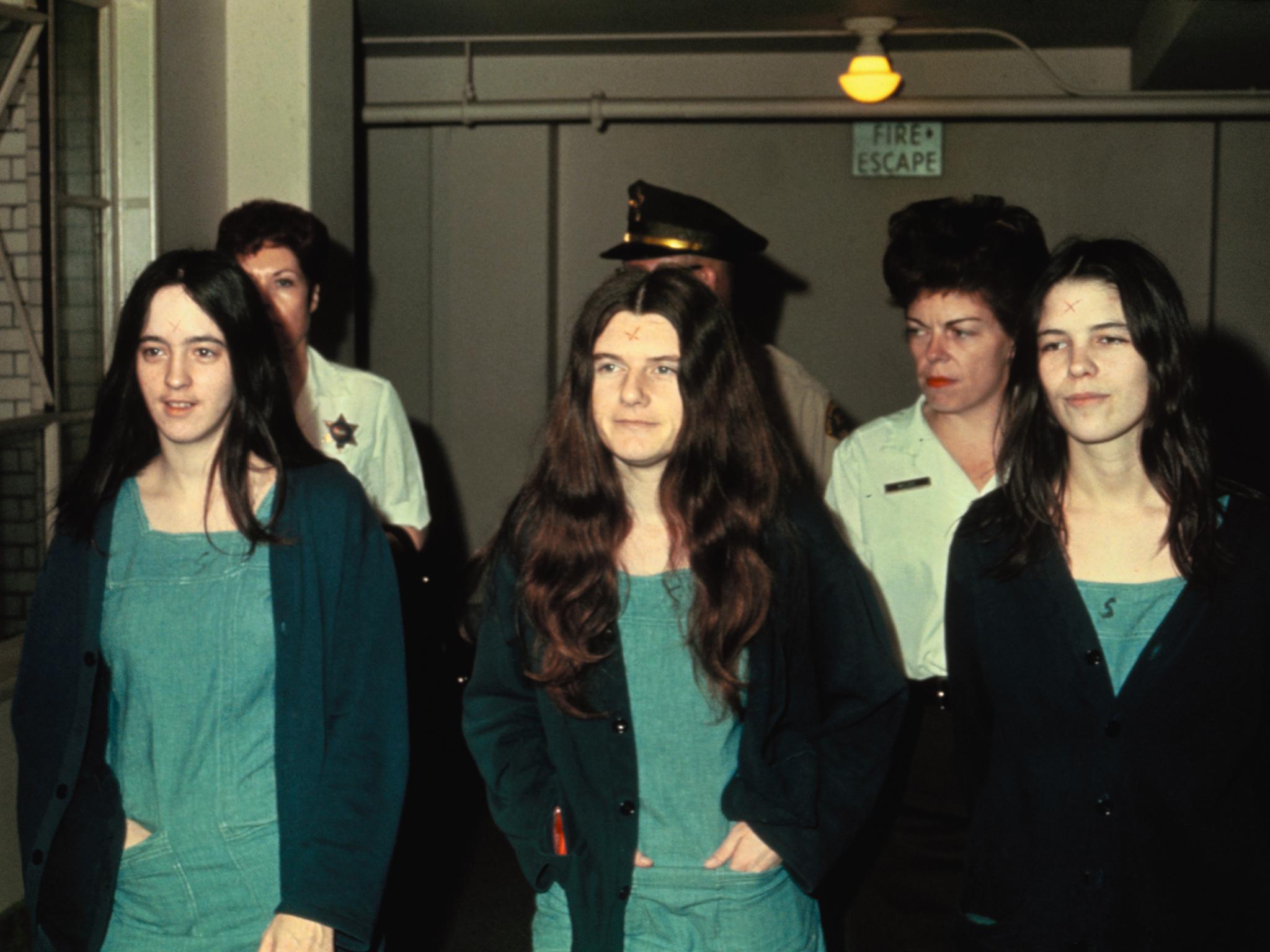 Susan Atkins, Patricia Krenwinkle, and Leslie Van Houten enter court in 1969