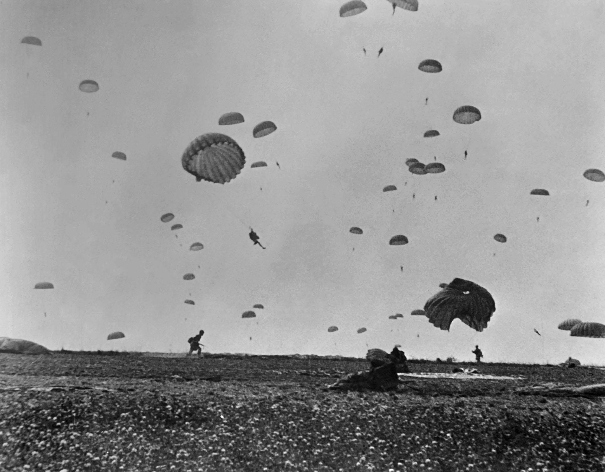 Parachutists landing in the fields Normandy