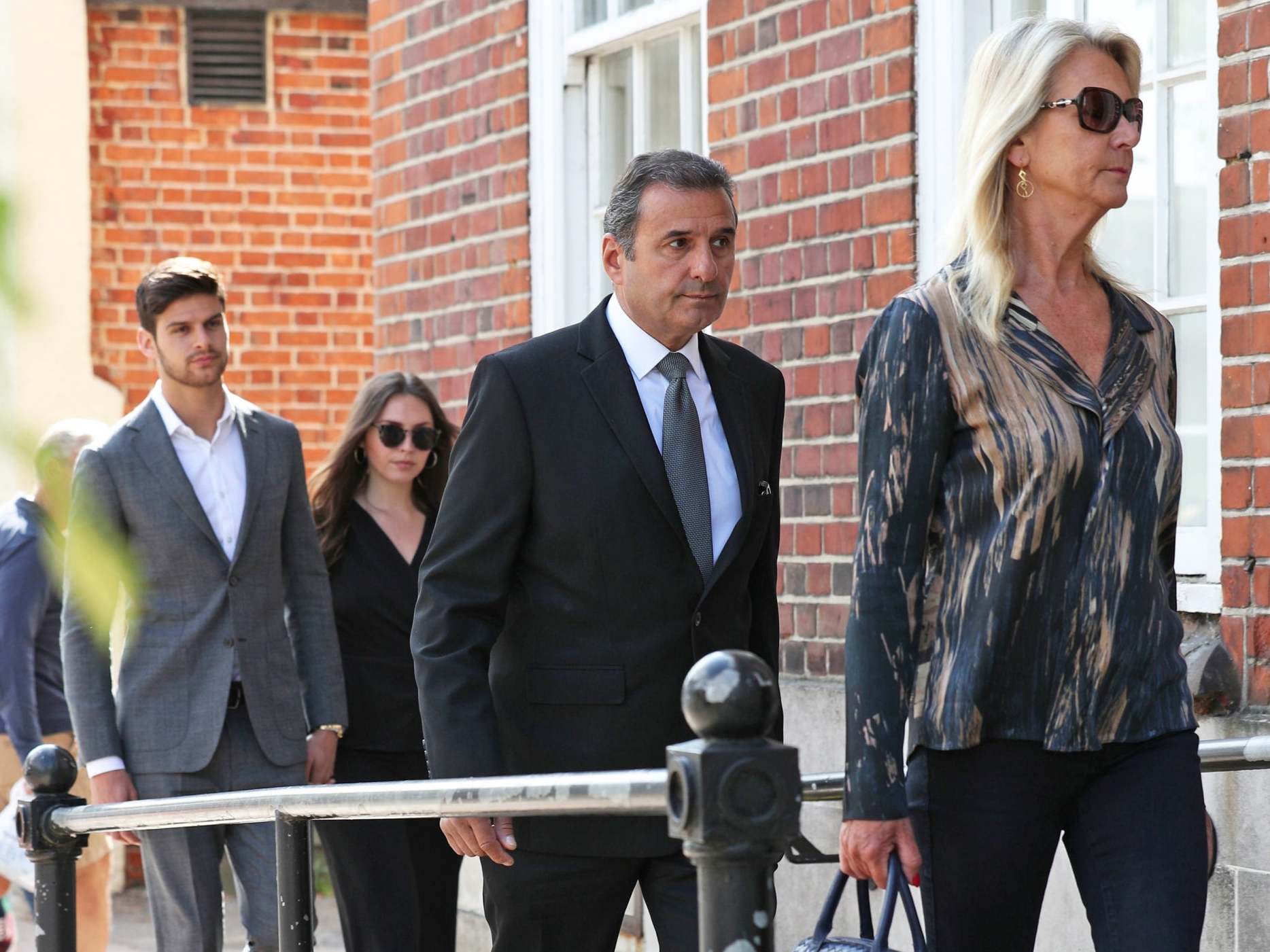 Parents Shirley and Andy Thalassitis (right and second right) and brother Nick Thalassitis (left) and his partner arrive at North London Coroner's Court in Barnet for the inquest into the death of Mike Thalassitis on 5 June 2019.