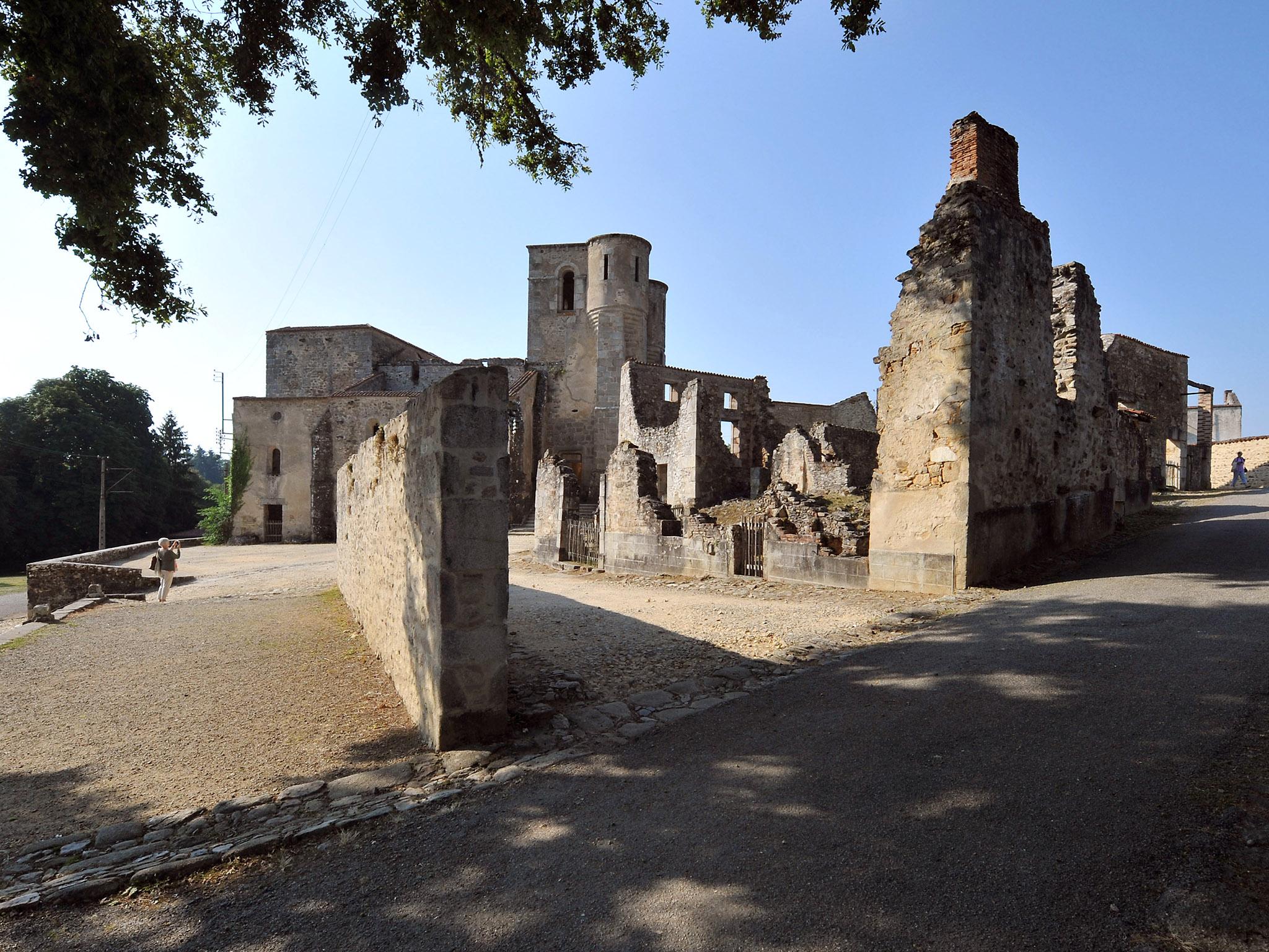 The graffiti, which was discovered on the wall at the entrance to the Centre for Remembrance on Friday, was covered by a tarpaulin by officials in Oradour-Sur-Glane