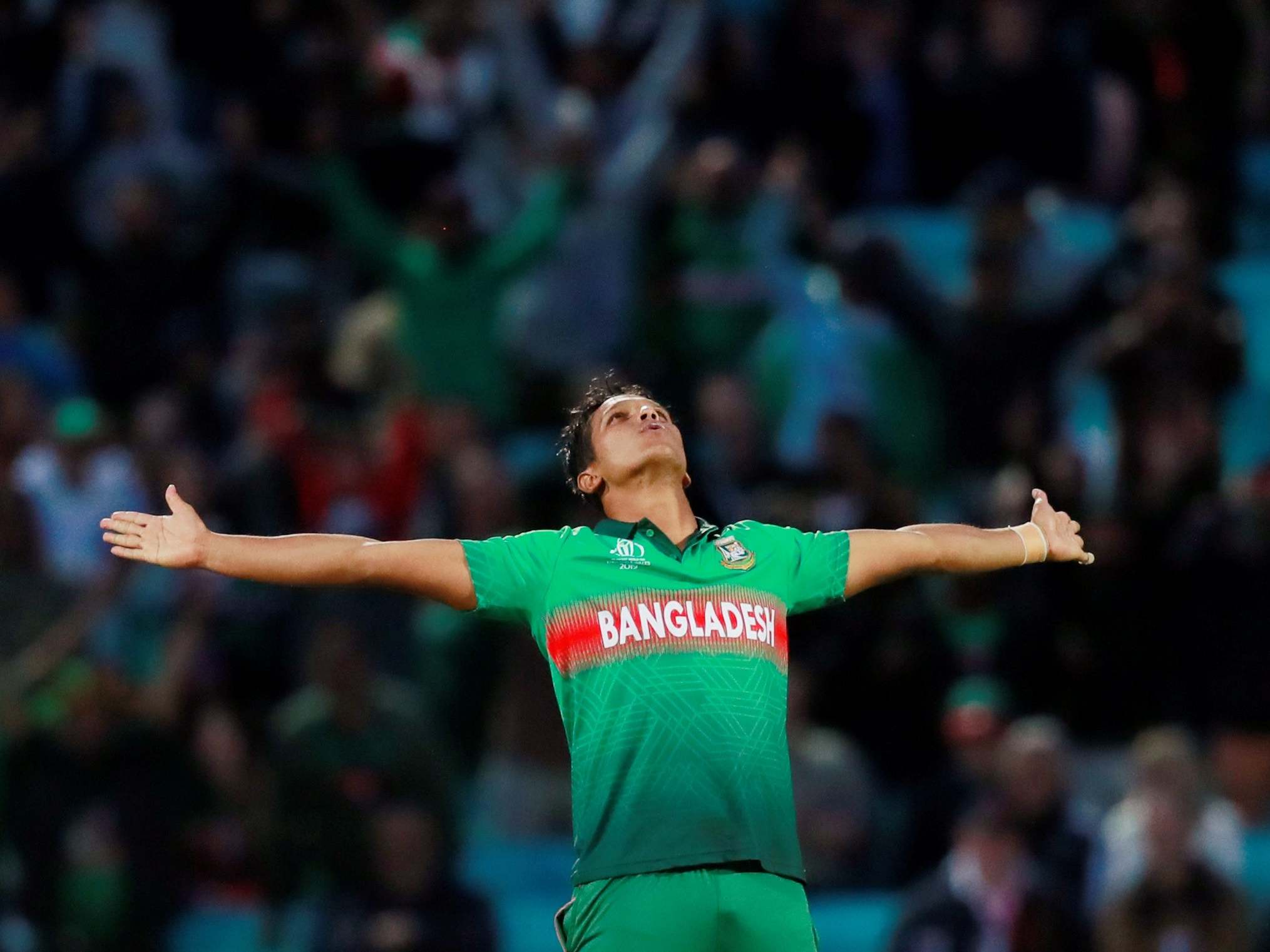 Mohammad Saifuddin celebrates bowling out New Zealand’s Matt Henry